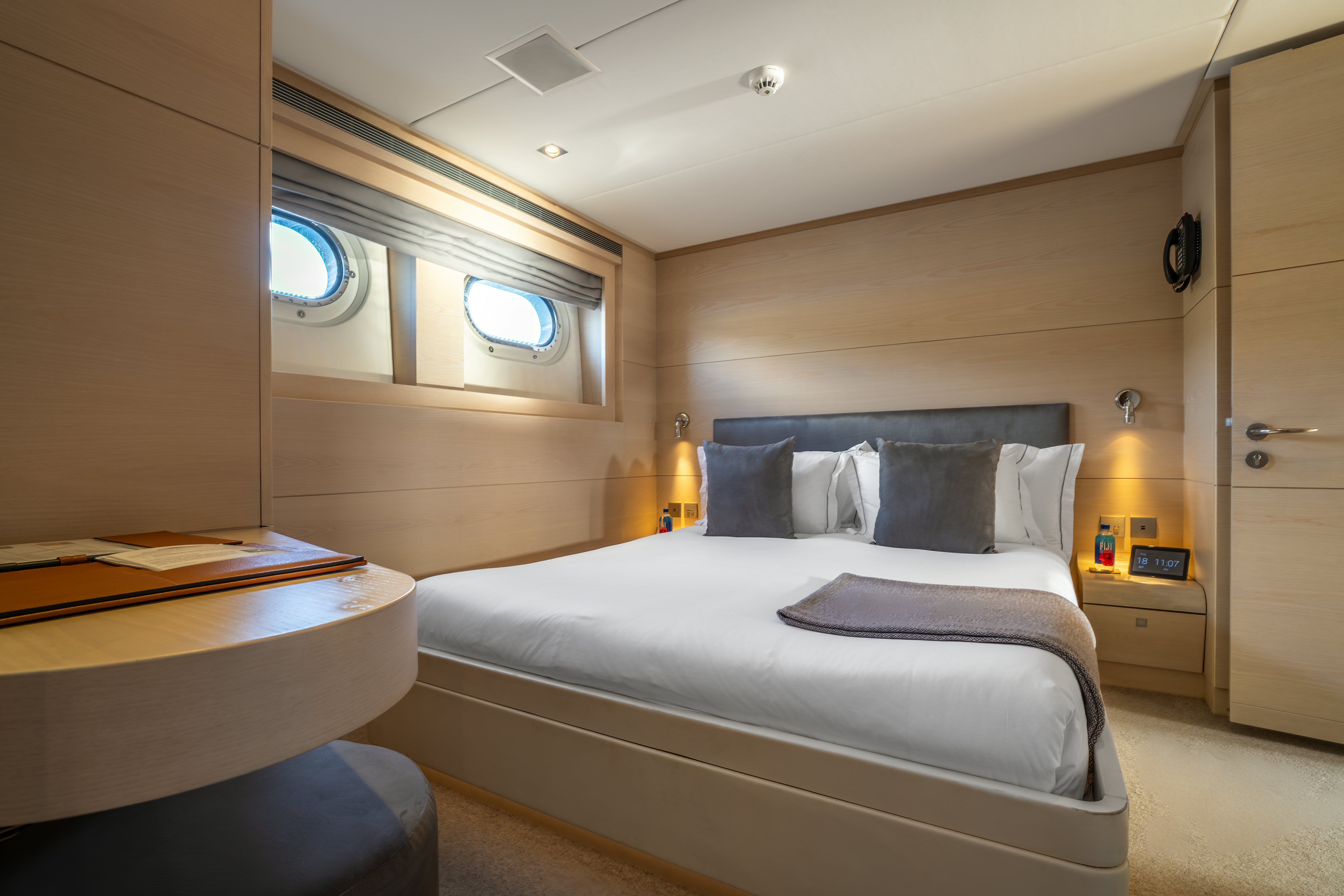 a room with a bed and a desk aboard G3 Yacht for Sale