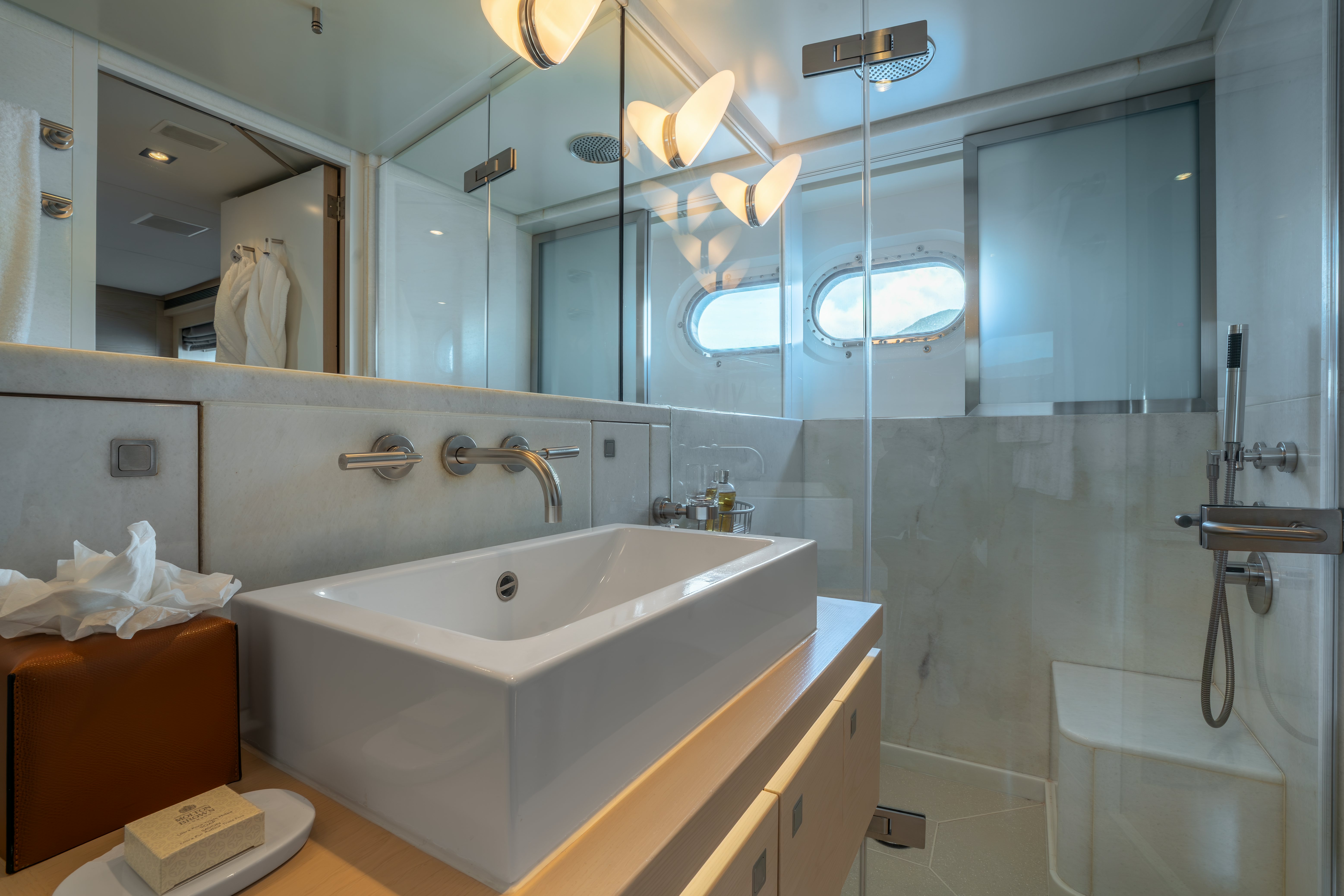 a bathroom with a glass shower aboard G3 Yacht for Sale