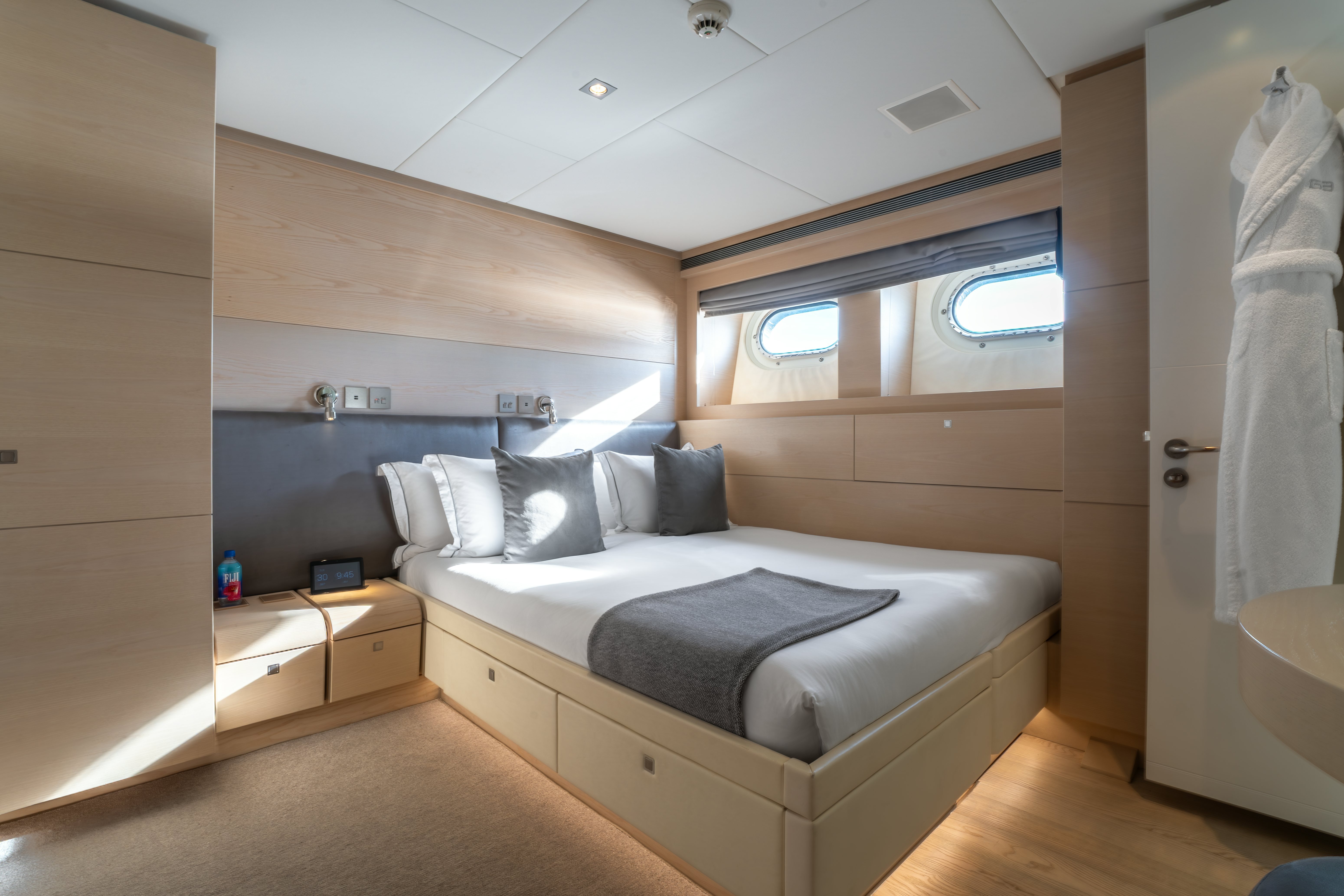 a room with a bed and a desk aboard G3 Yacht for Sale