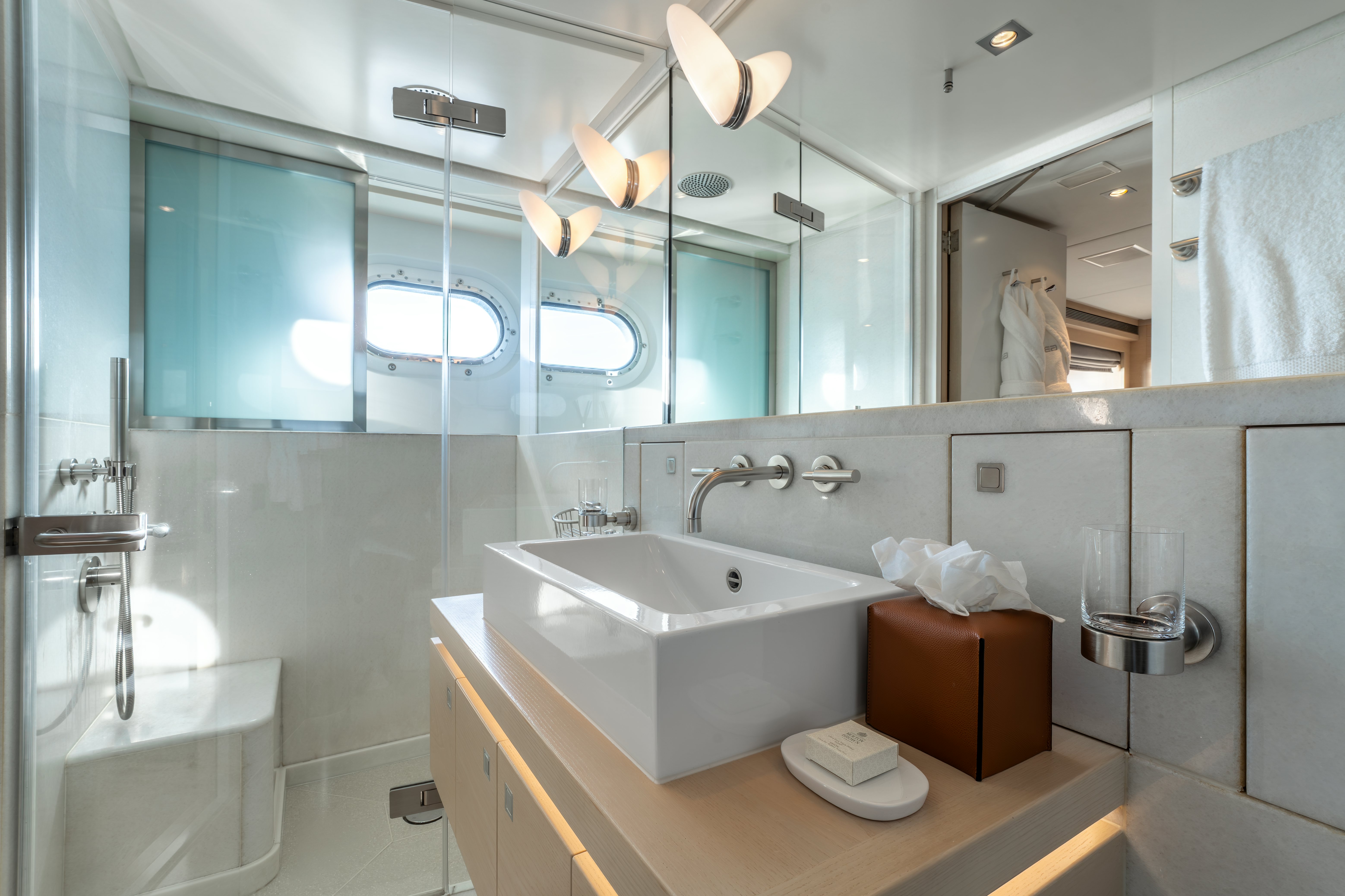 a bathroom with a large mirror aboard G3 Yacht for Sale