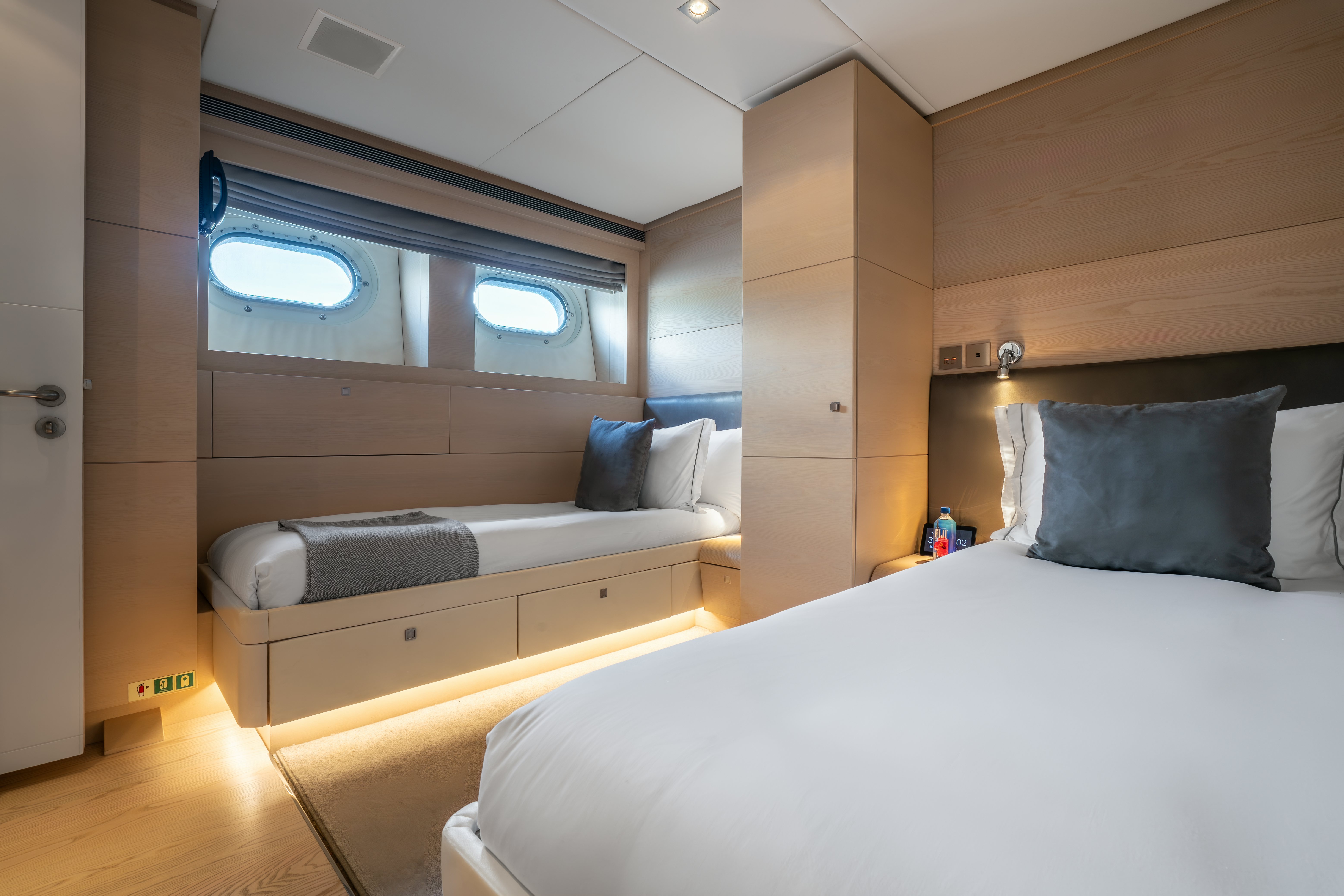 a room with a bed and a couch aboard G3 Yacht for Sale