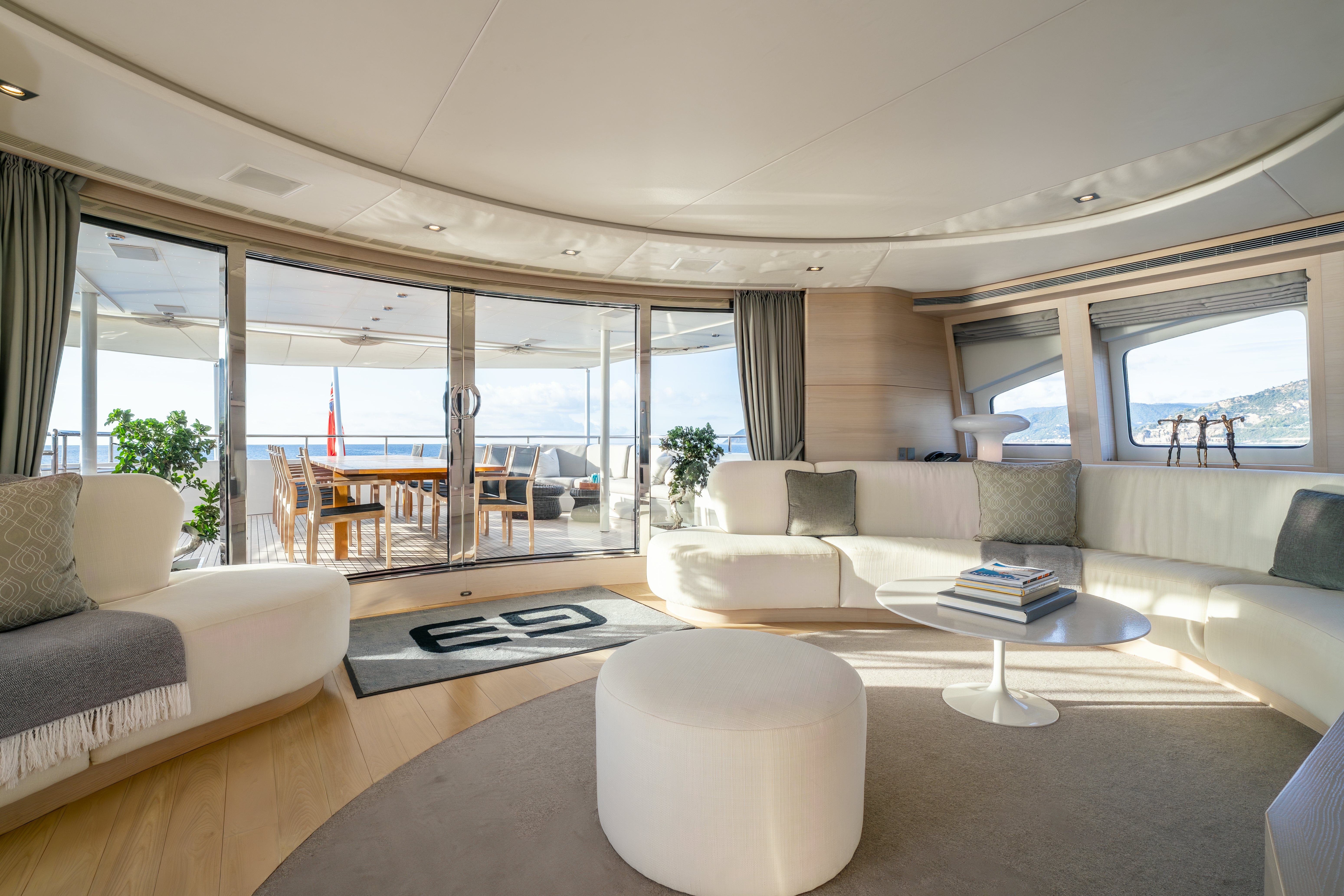 a living room with a large window aboard G3 Yacht for Sale