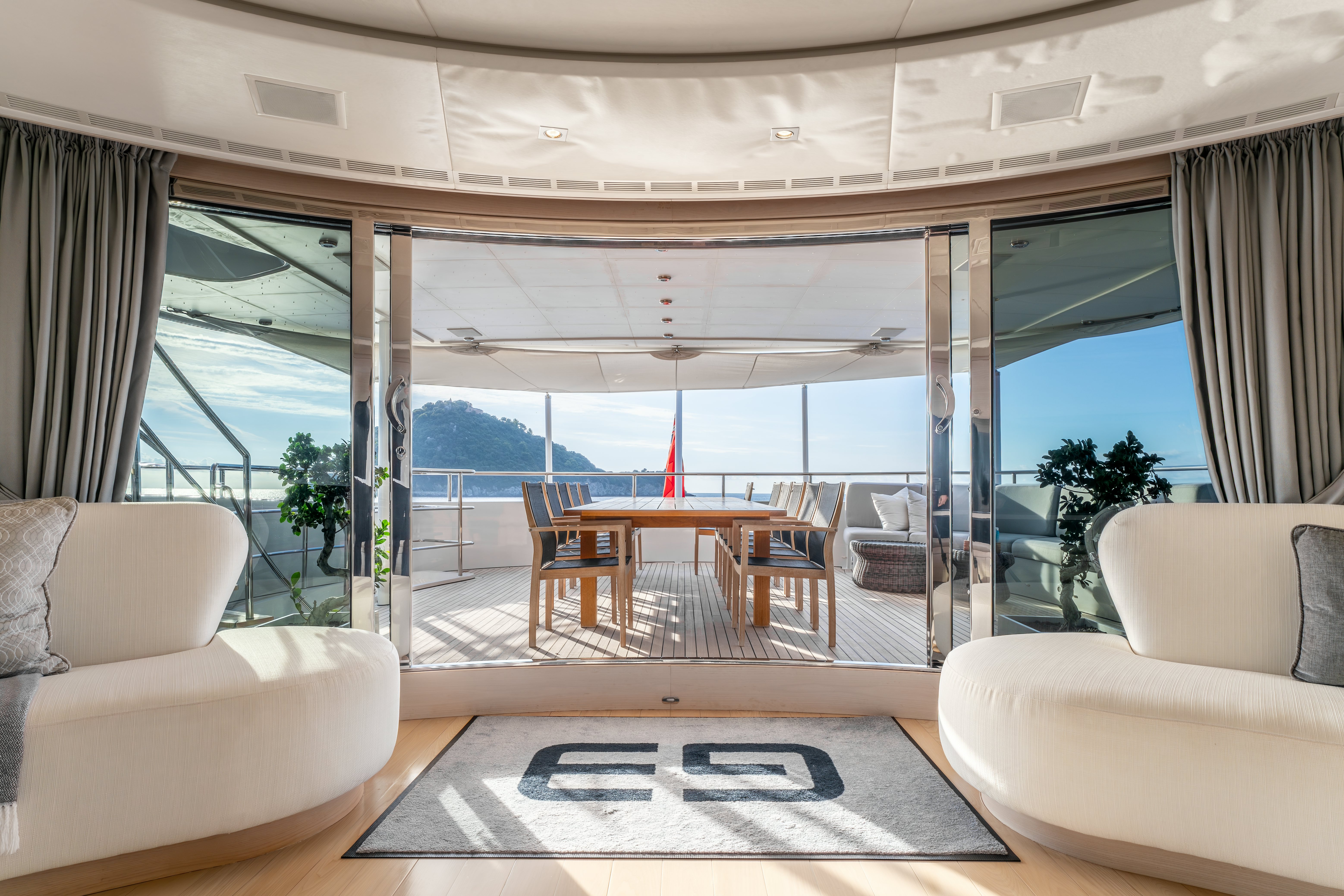 a living room with a large window aboard G3 Yacht for Sale