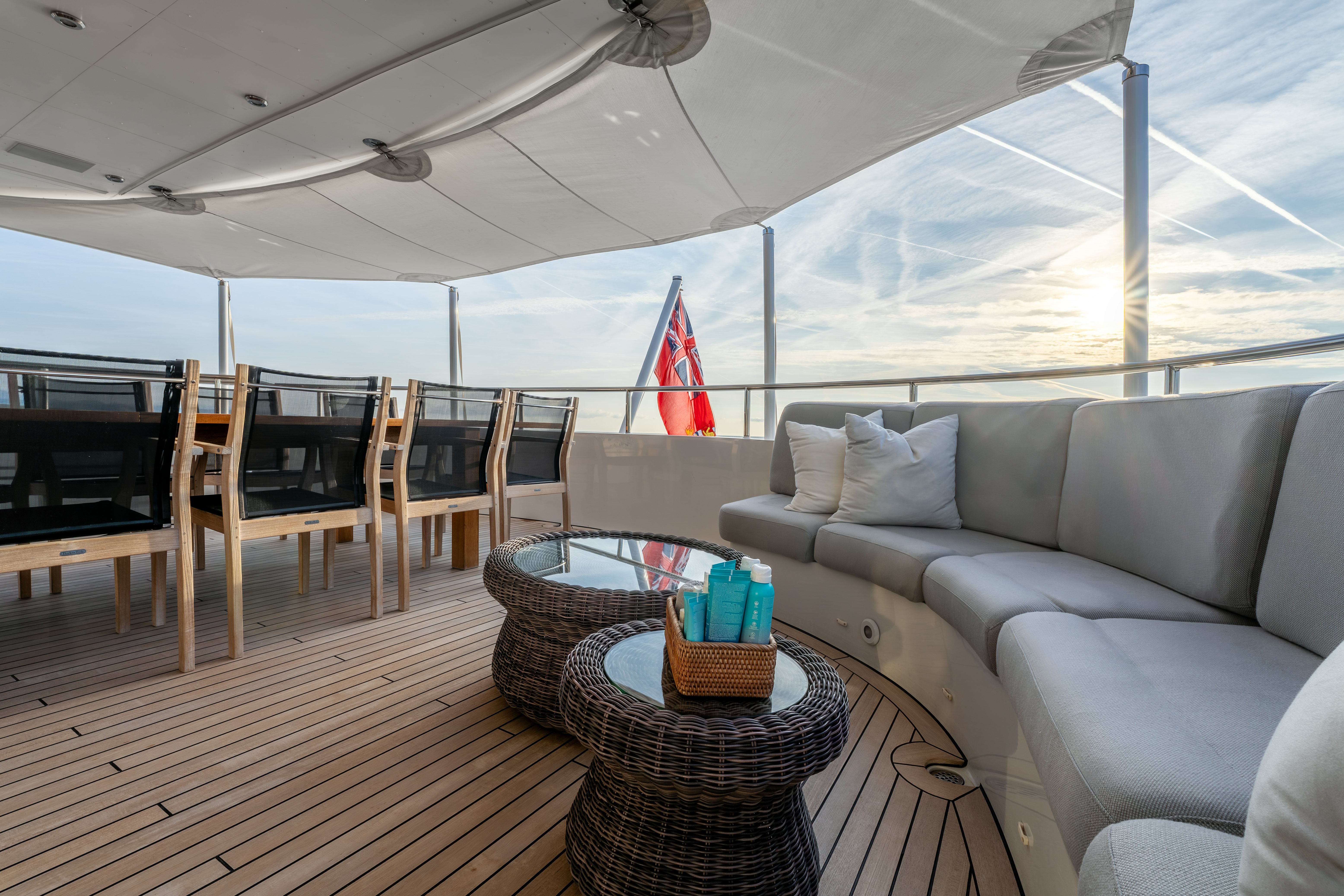 a living room with a couch and a table aboard G3 Yacht for Sale