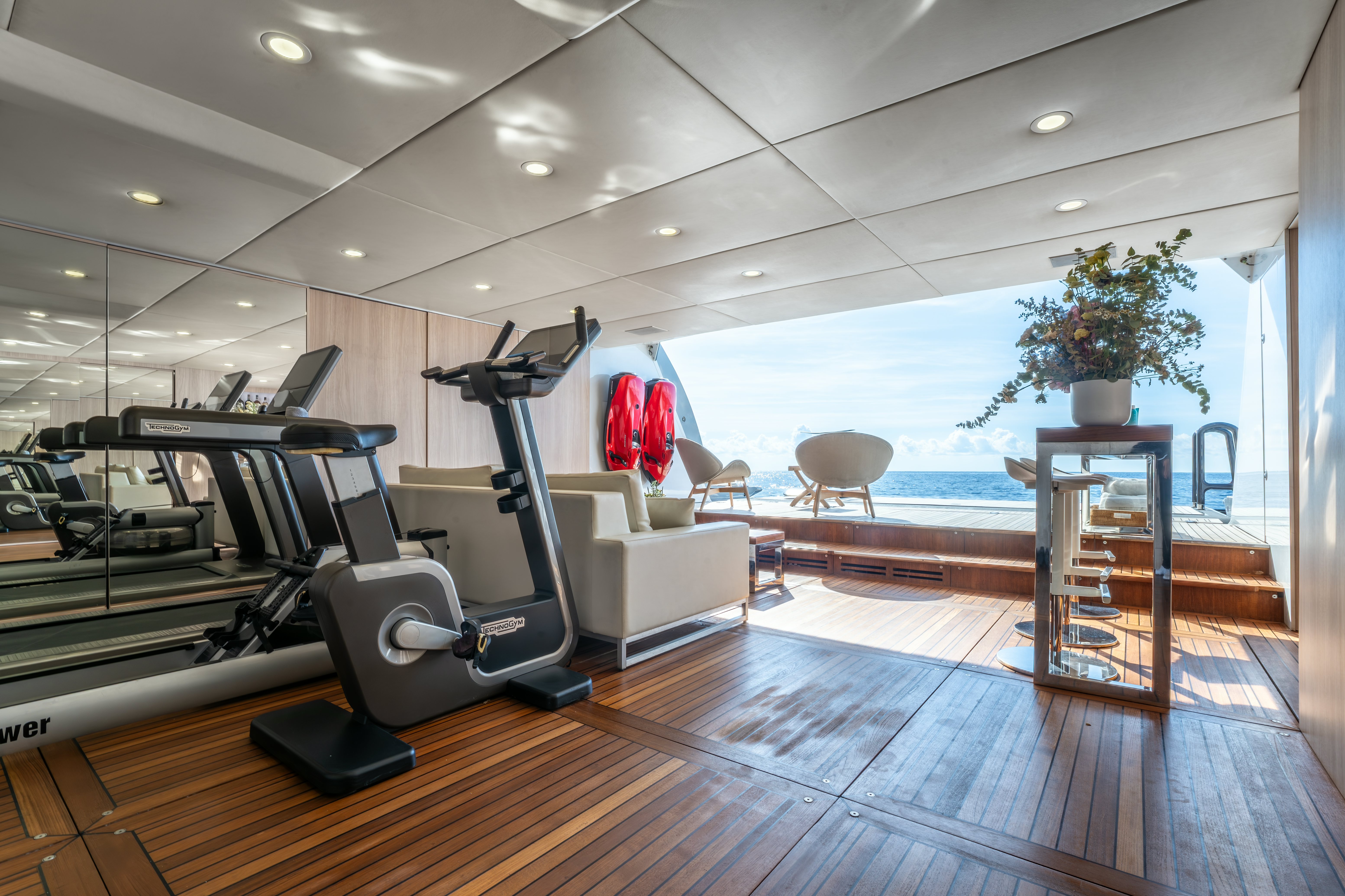 a room with a deck and a pool aboard G3 Yacht for Sale