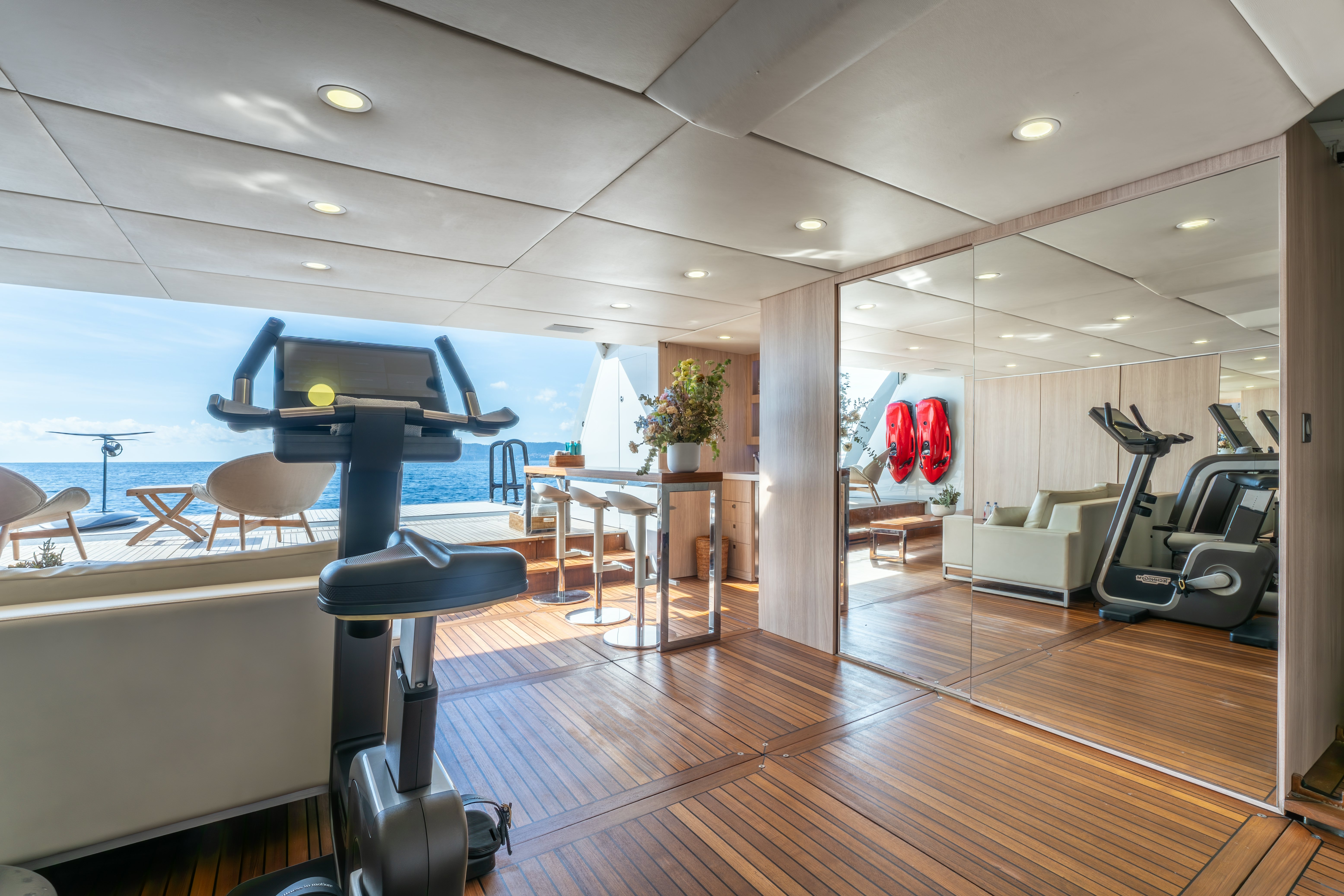 a room with a pool table and chairs aboard G3 Yacht for Sale