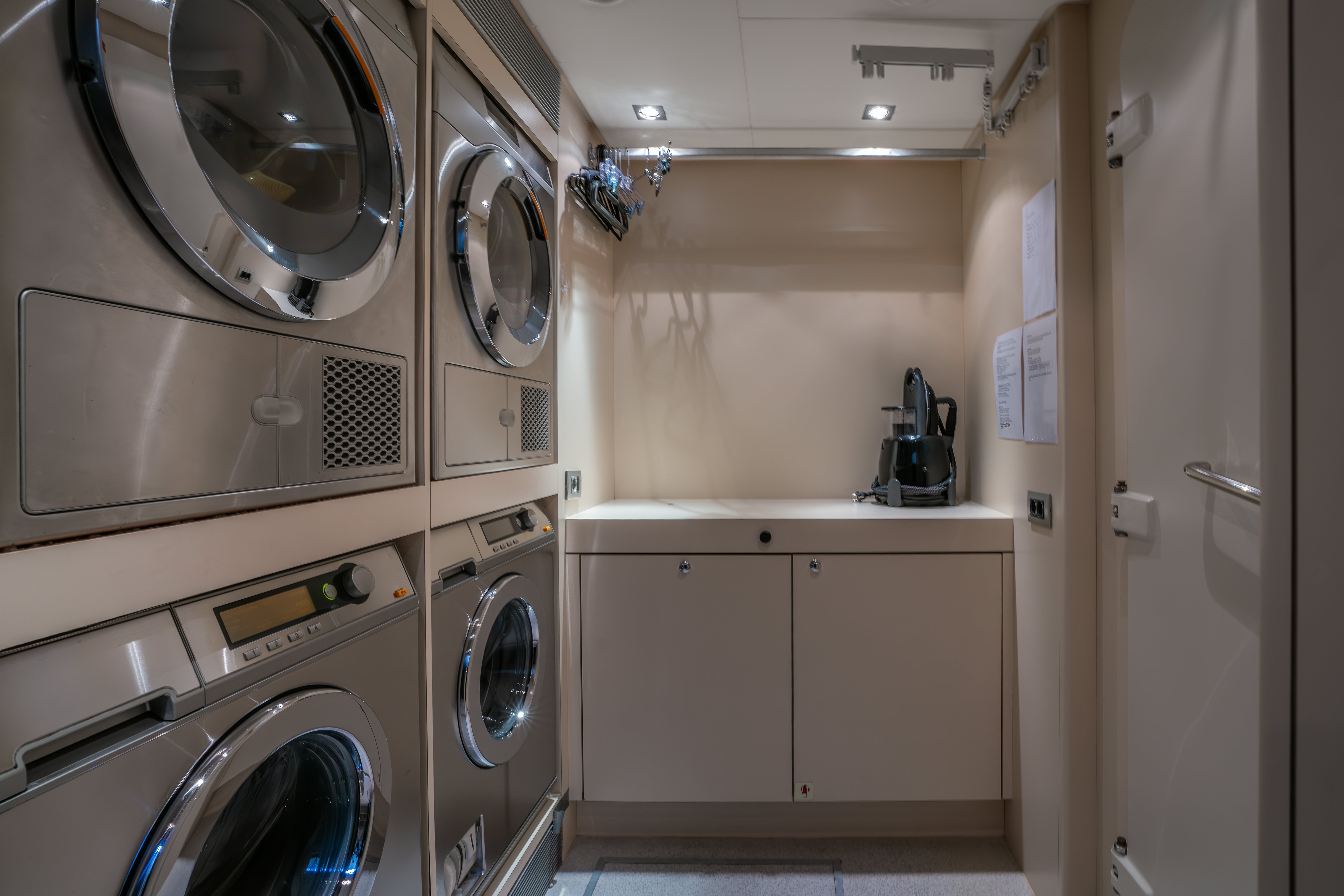 a washer and dryer in a room aboard G3 Yacht for Sale