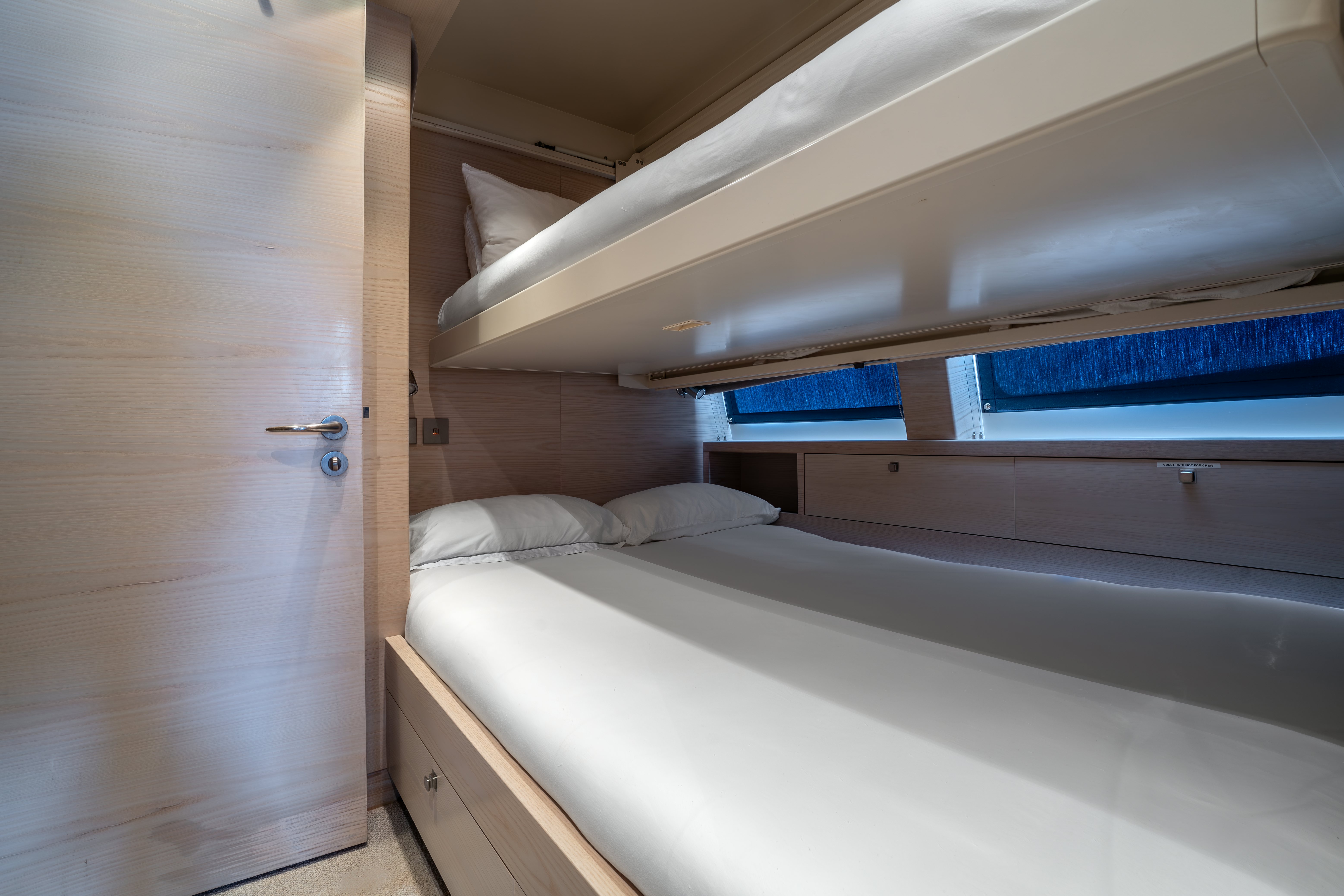 a room with bunk beds aboard G3 Yacht for Sale