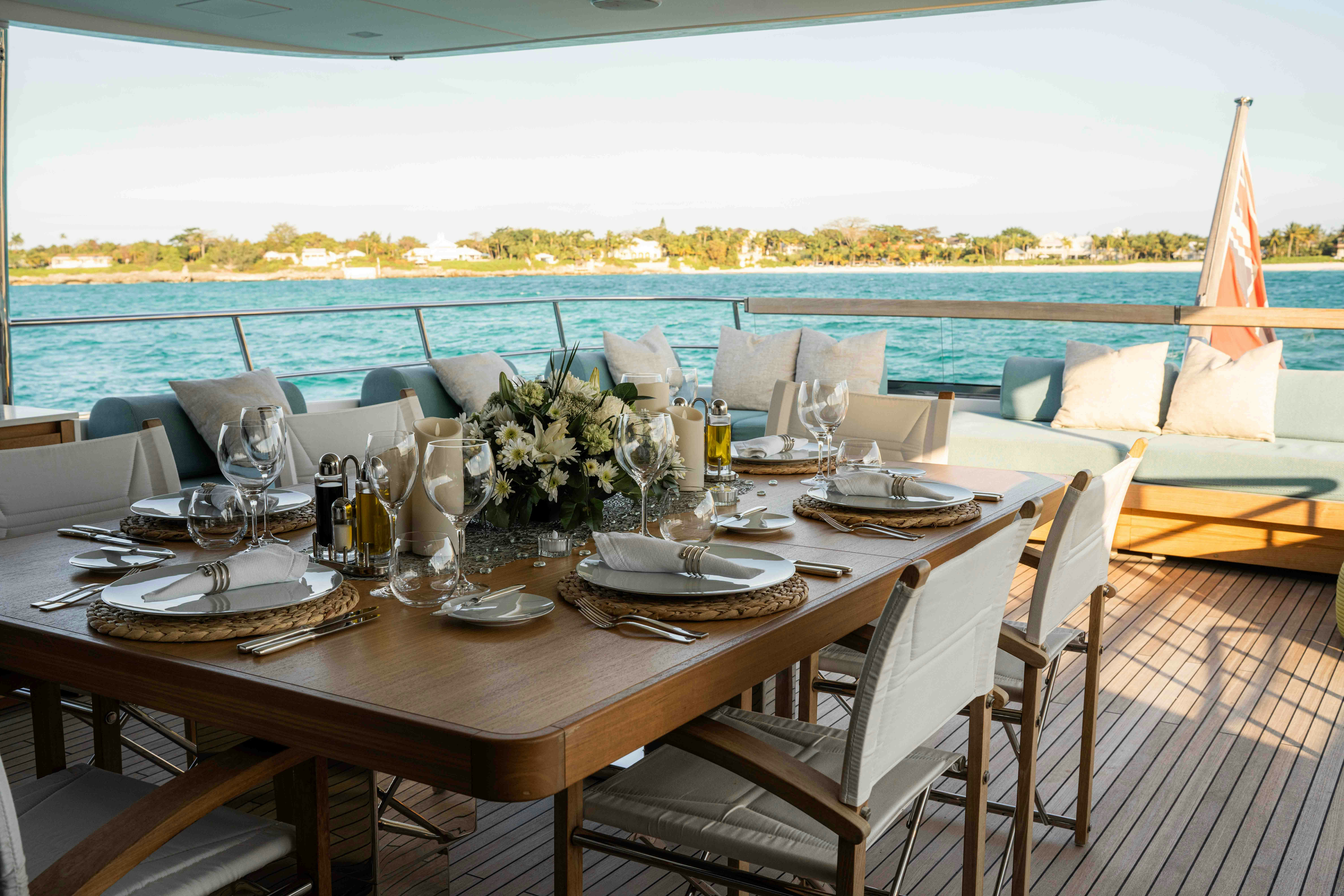 a table set for a dinner aboard PREMURA Yacht for Charter