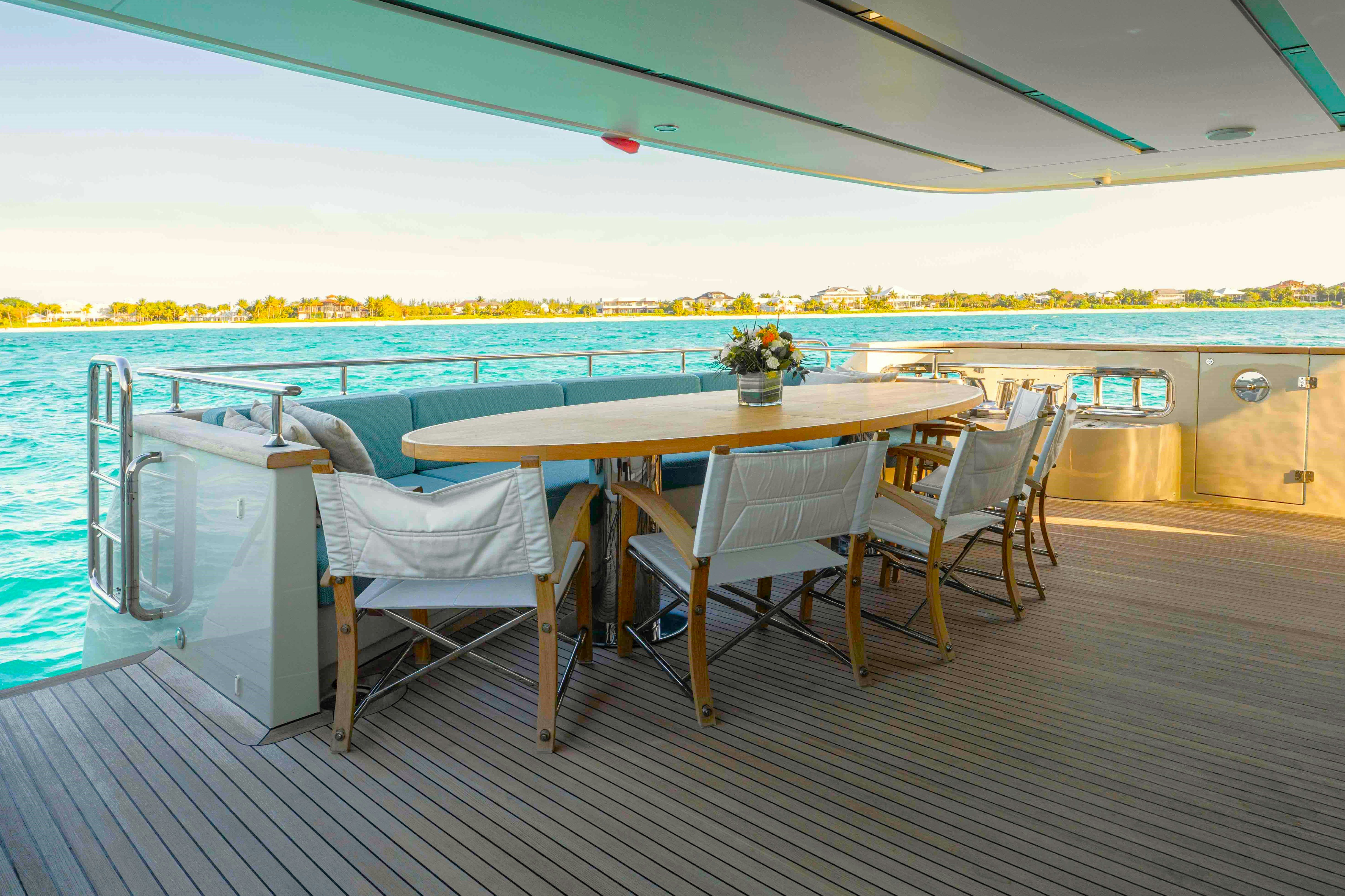 a table and chairs on a deck aboard PREMURA Yacht for Charter
