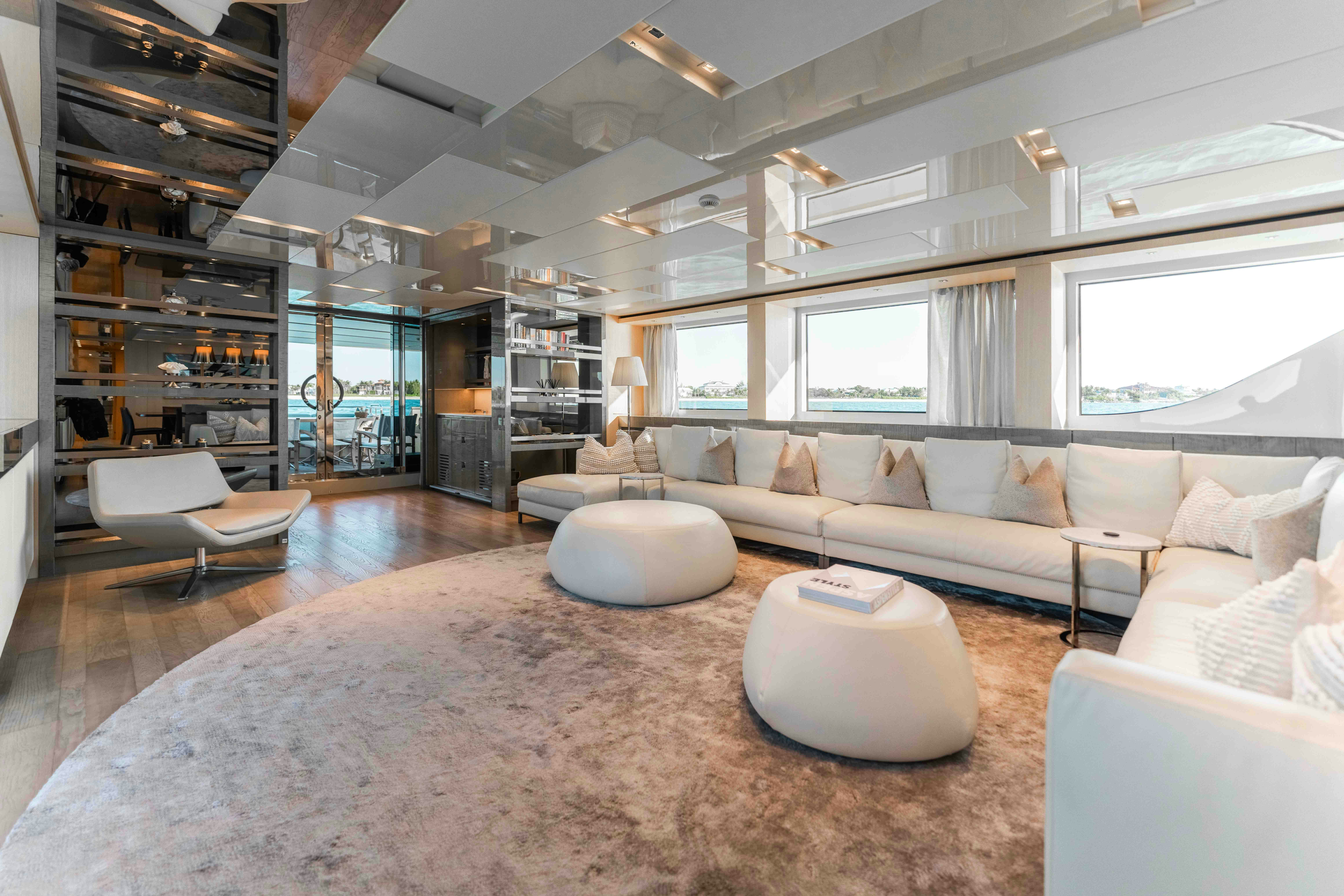 a living room with a large rug aboard PREMURA Yacht for Charter