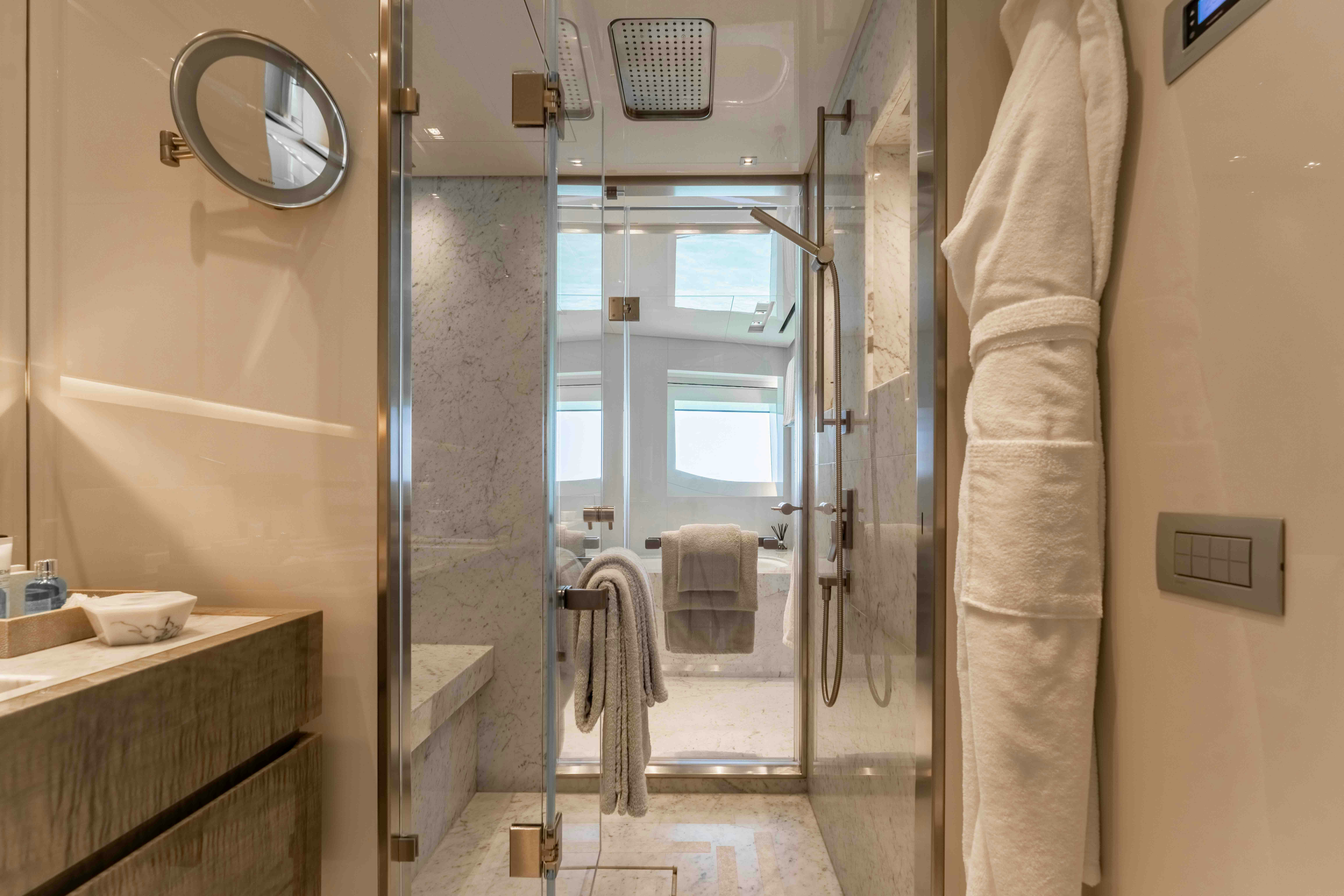 a bathroom with a glass shower aboard PREMURA Yacht for Charter