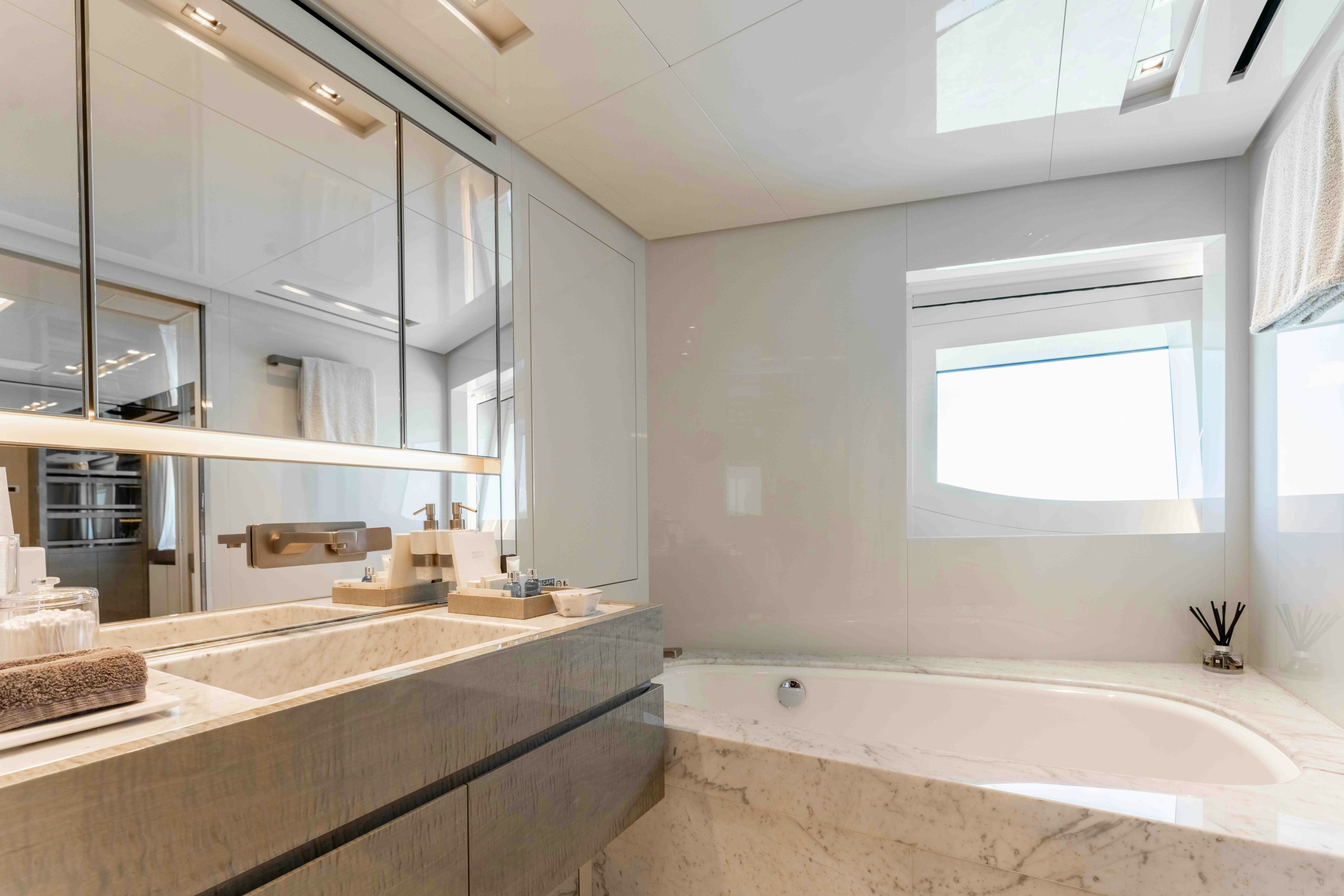 a bathroom with a large mirror aboard PREMURA Yacht for Charter