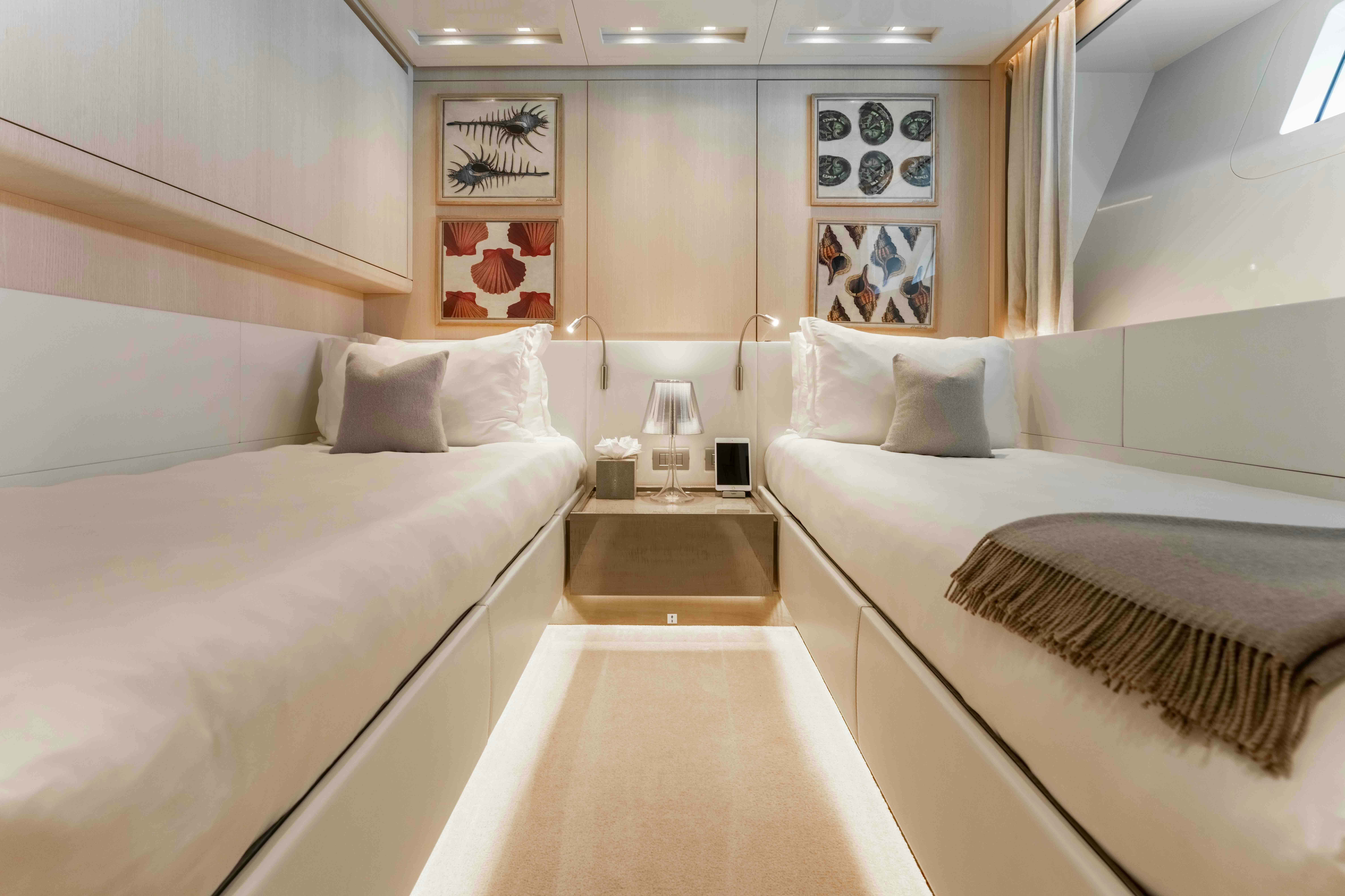 a room with two beds aboard PREMURA Yacht for Charter