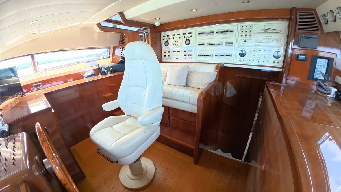 a room with a chair and a table aboard NORTHSTAR I Yacht for Sale