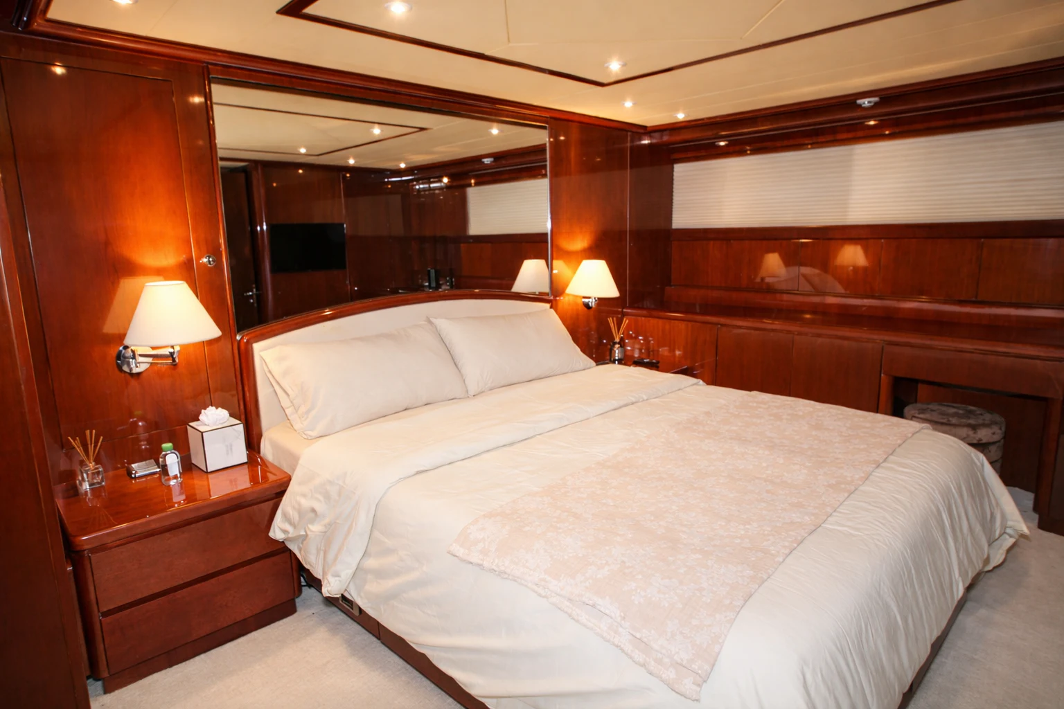 a hotel room with a bed and a lamp aboard NORTHSTAR I Yacht for Sale
