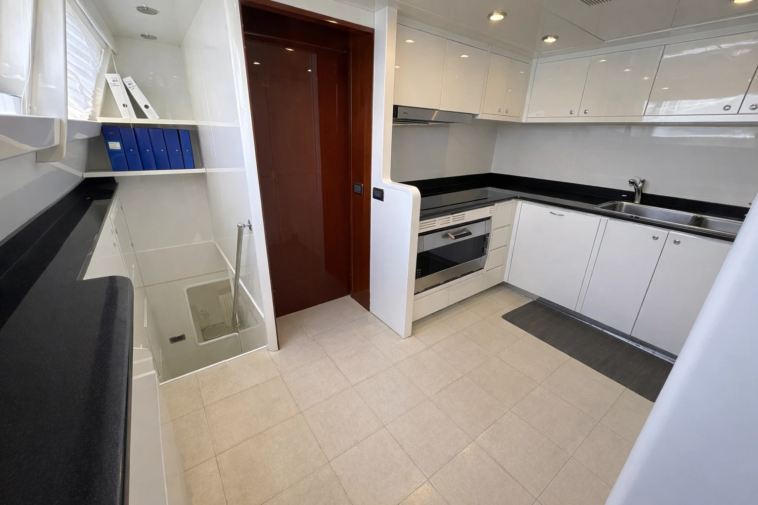 a kitchen with white cabinets aboard NORTHSTAR I Yacht for Sale