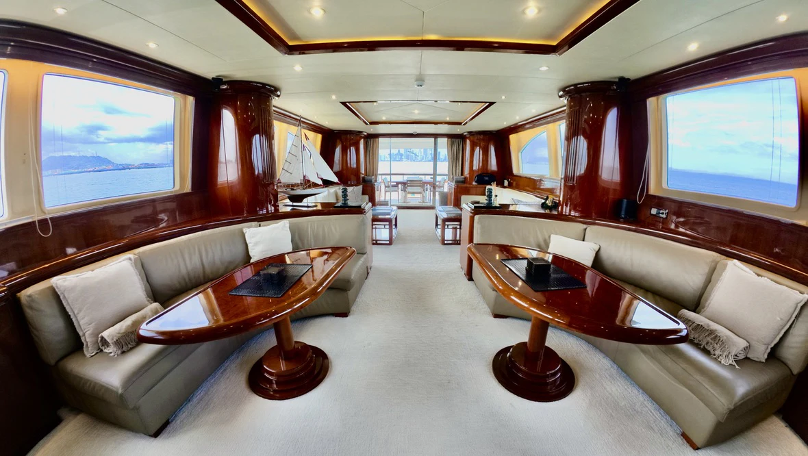 a living room with a large screen aboard NORTHSTAR I Yacht for Sale