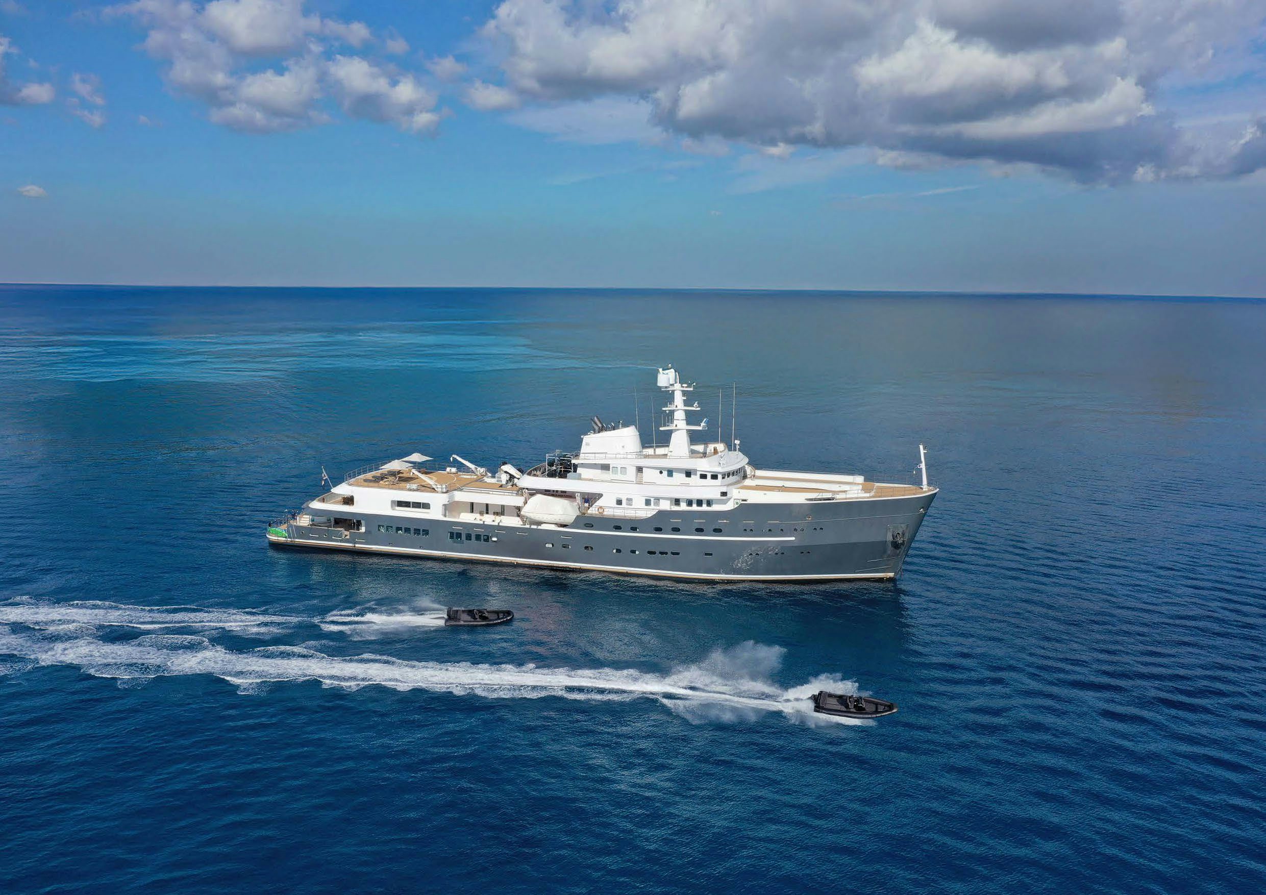 a large ship in the water aboard AQUA LARES Yacht for Charter