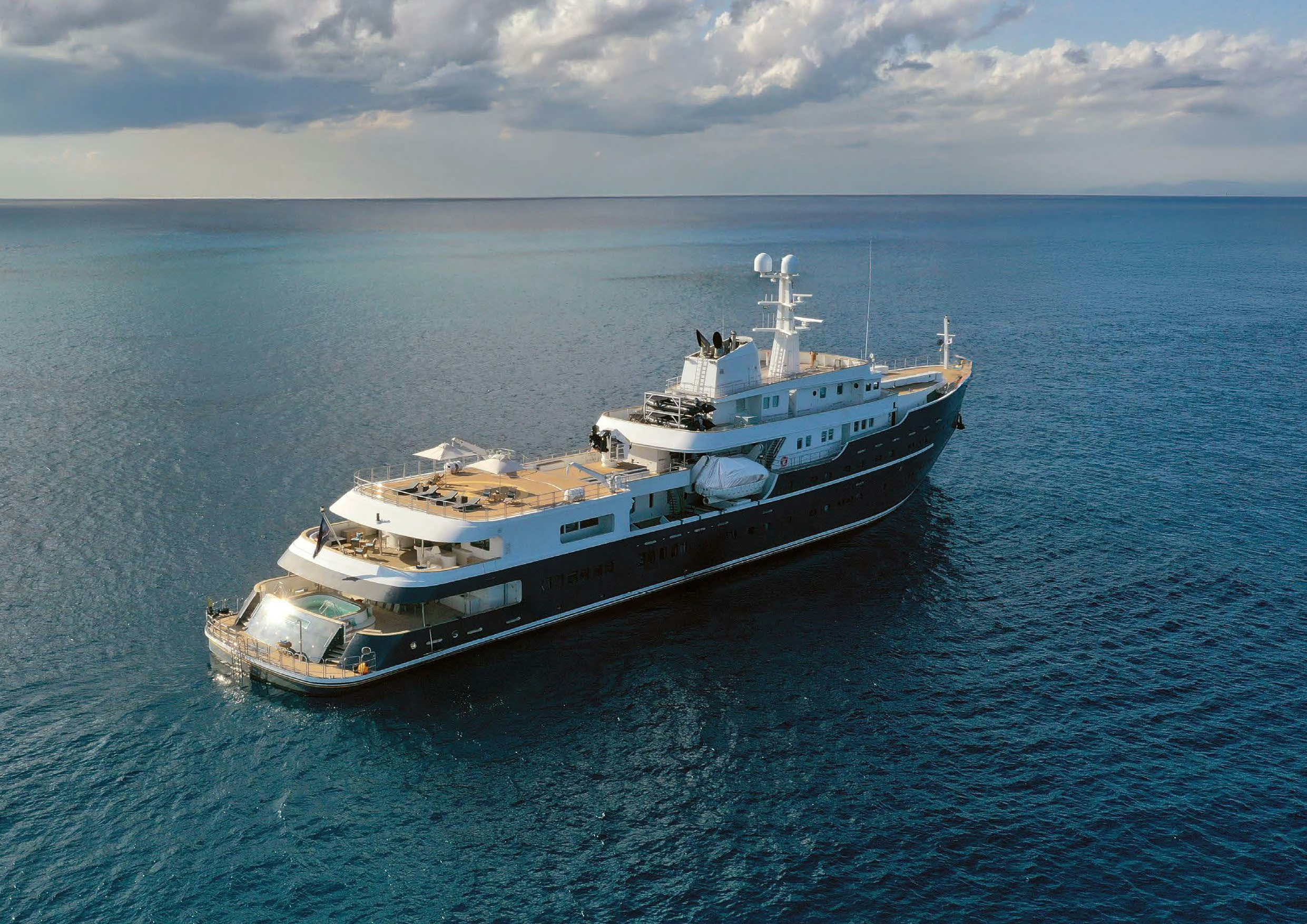 a large ship in the water aboard AQUA LARES Yacht for Charter