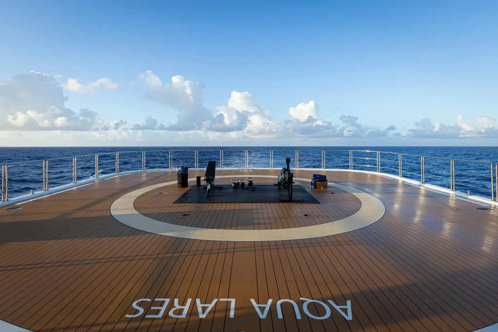 a boardwalk with a boardwalk and a body of water aboard LEGEND Yacht for Charter