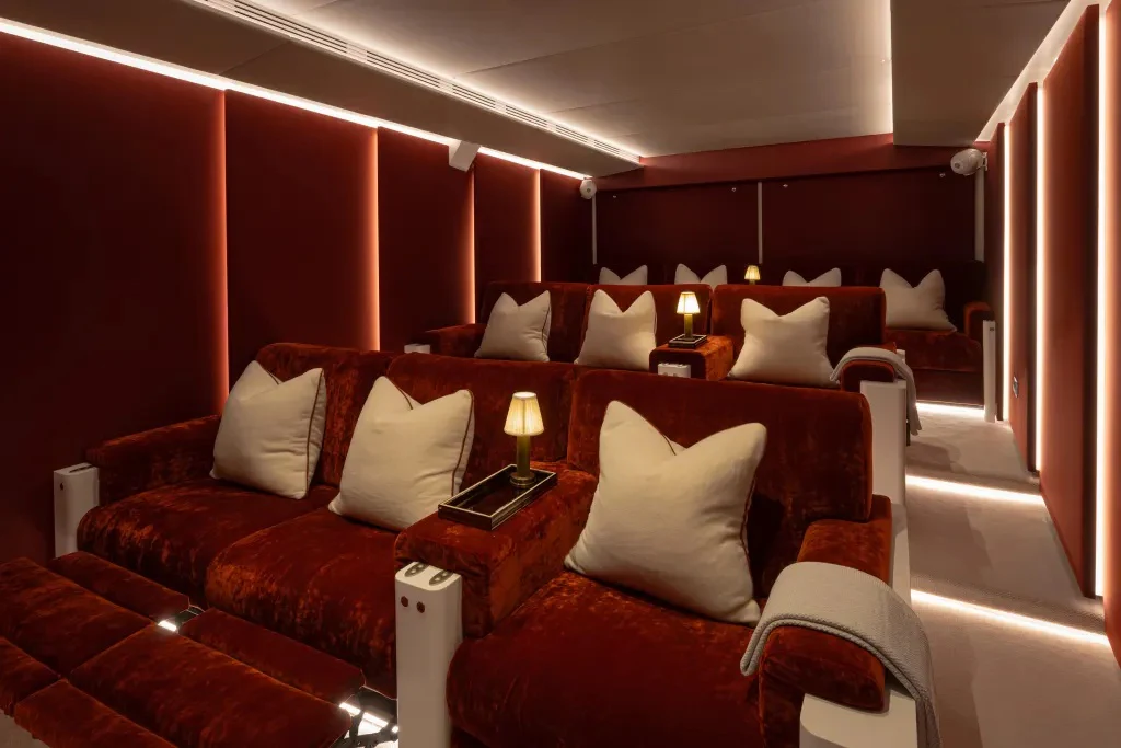 a room with a bed and a couch aboard LEGEND Yacht for Charter