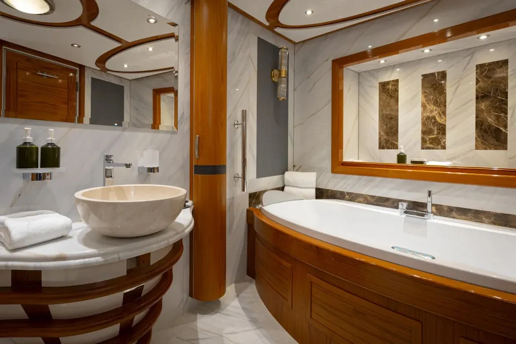 a bathroom with a sink and a bathtub aboard LEGEND Yacht for Charter
