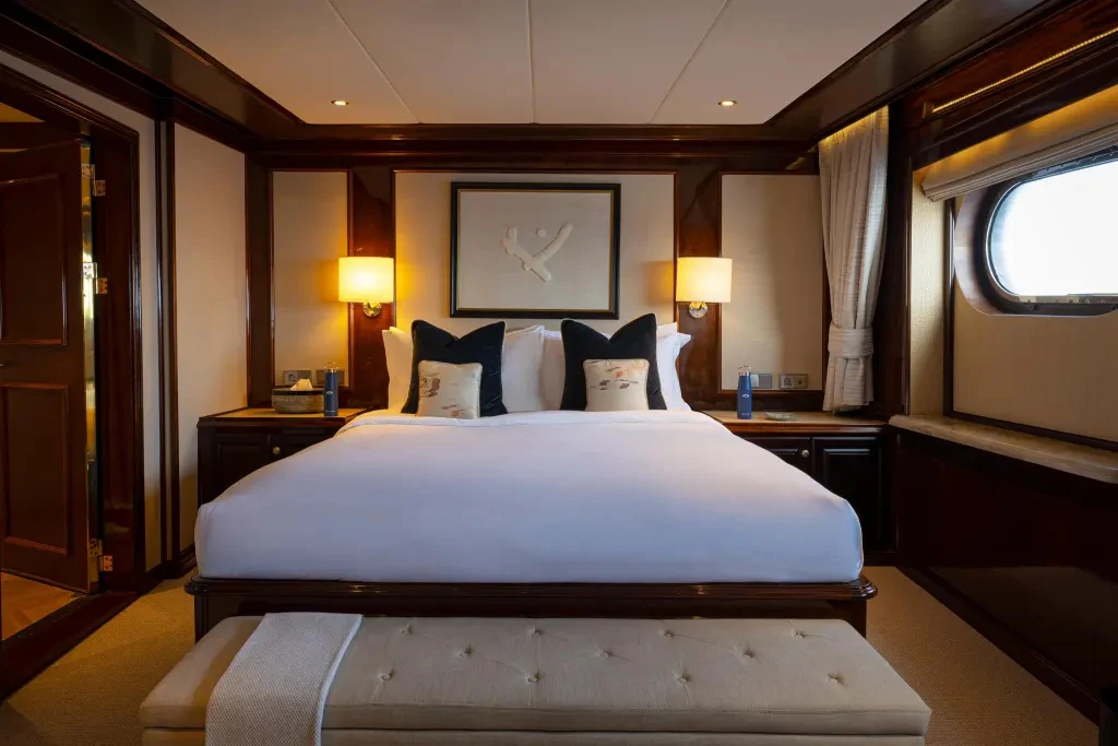 a bed in a hotel room aboard LEGEND Yacht for Charter