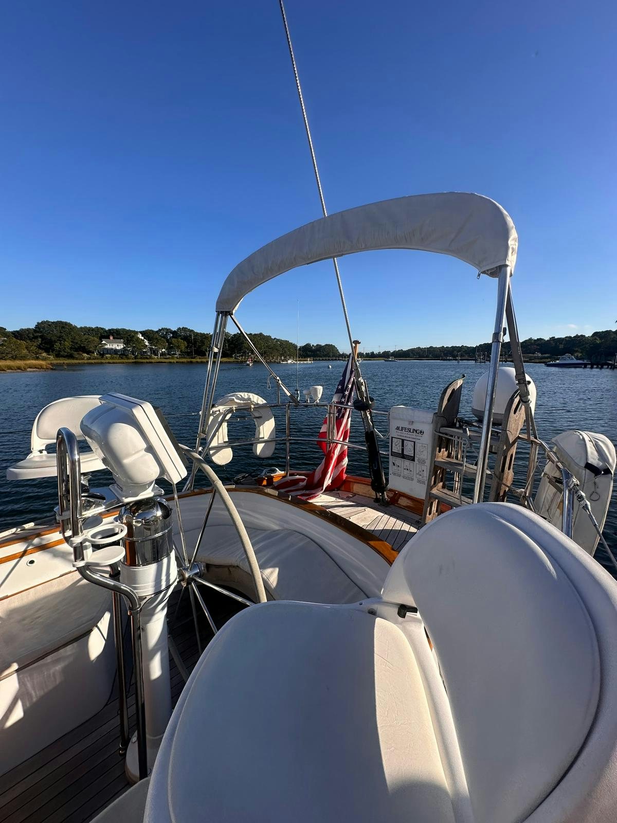 a boat with a canopy aboard II Yacht for Sale