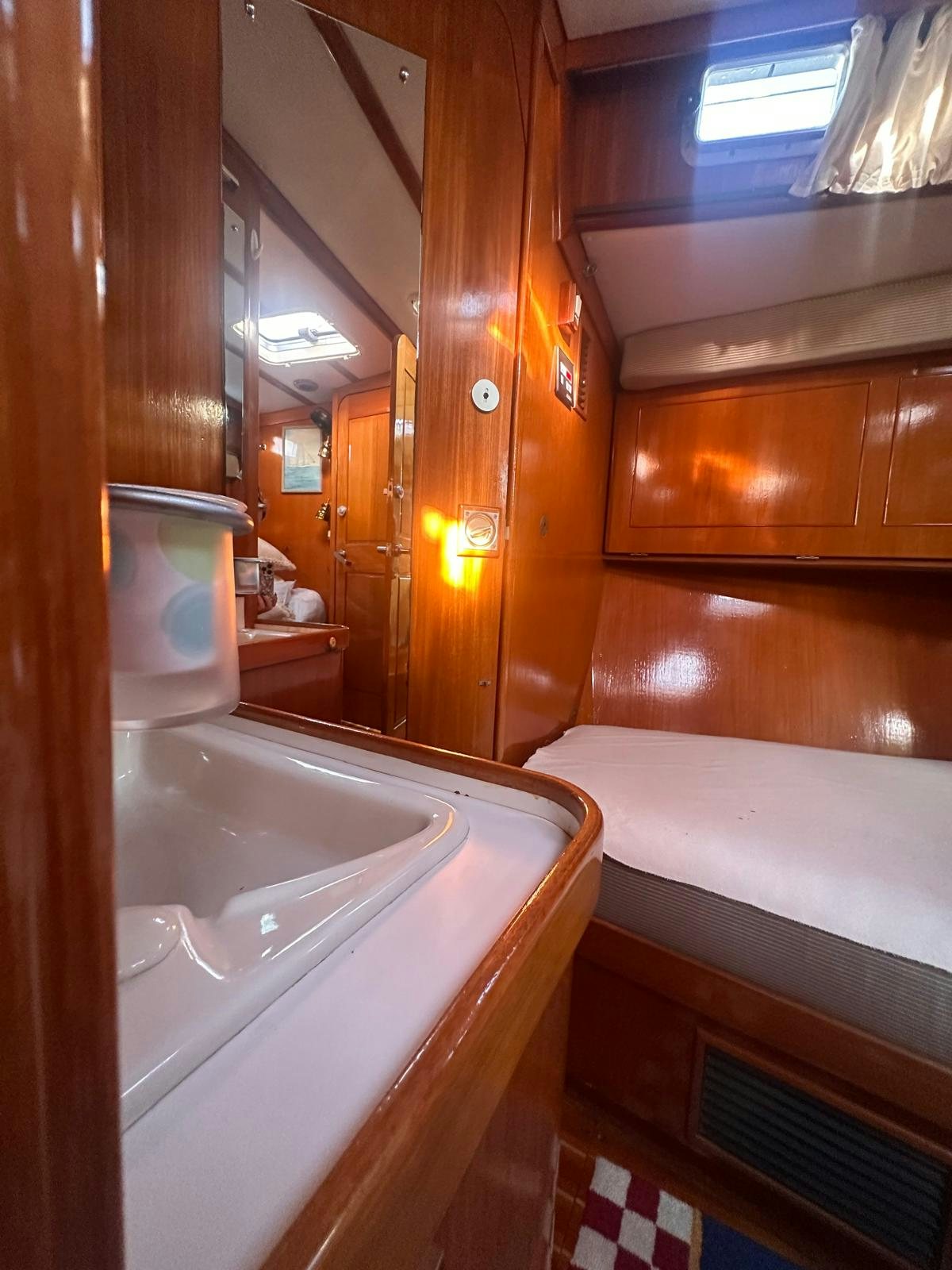 a bathroom with a bathtub and sink aboard II Yacht for Sale