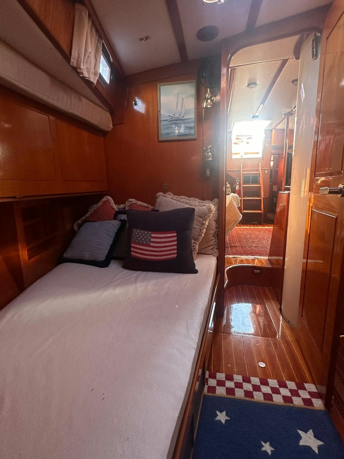 a bed in a room aboard II Yacht for Sale
