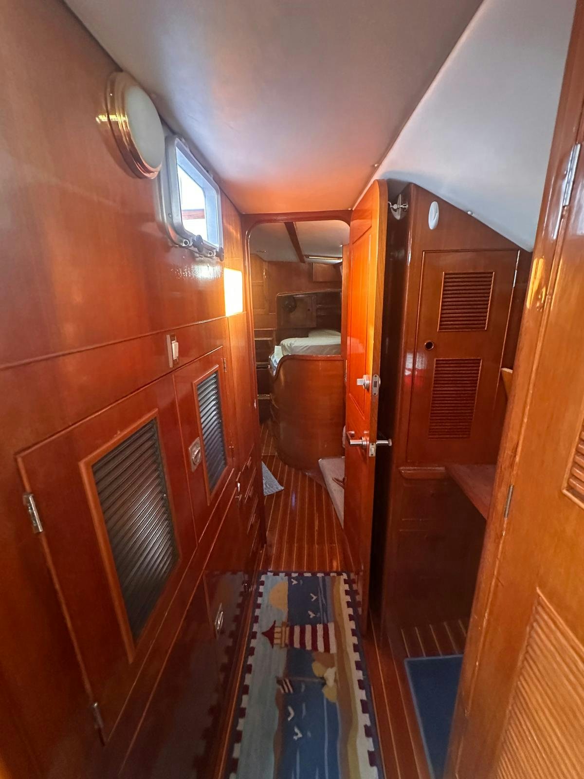 a hallway with wooden doors aboard II Yacht for Sale