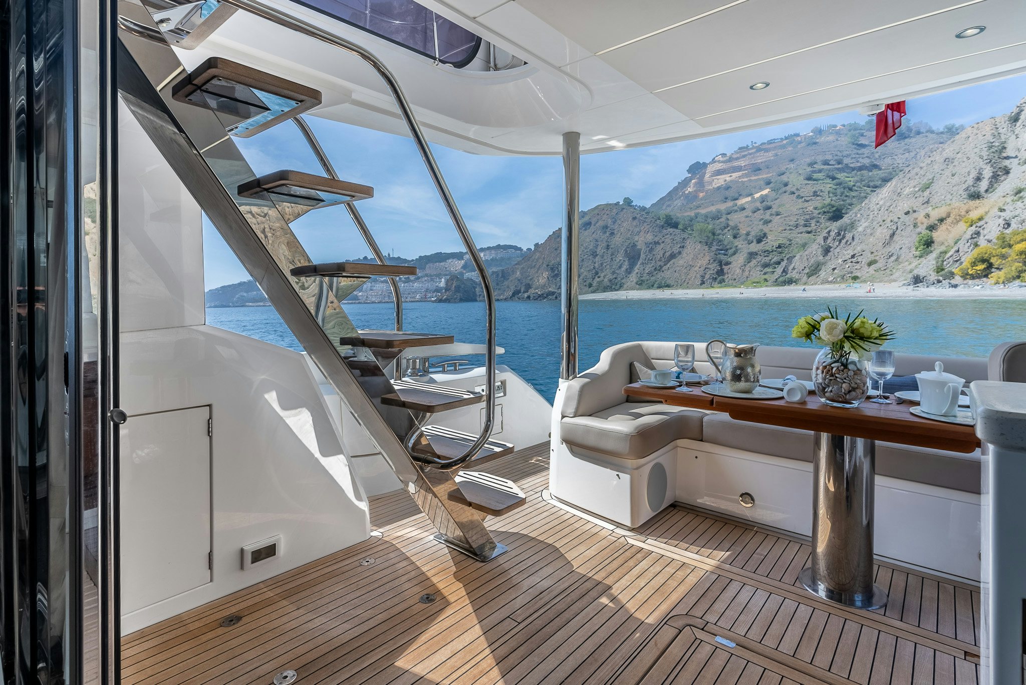 a room with a table and chairs aboard ISLA DE FLORA Yacht for Sale