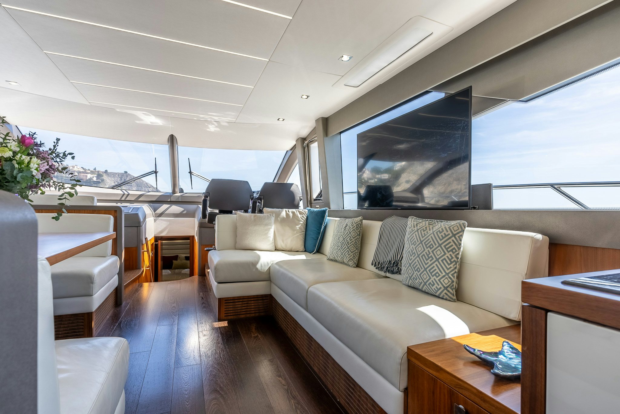 a living room with a couch and a table aboard ISLA DE FLORA Yacht for Sale