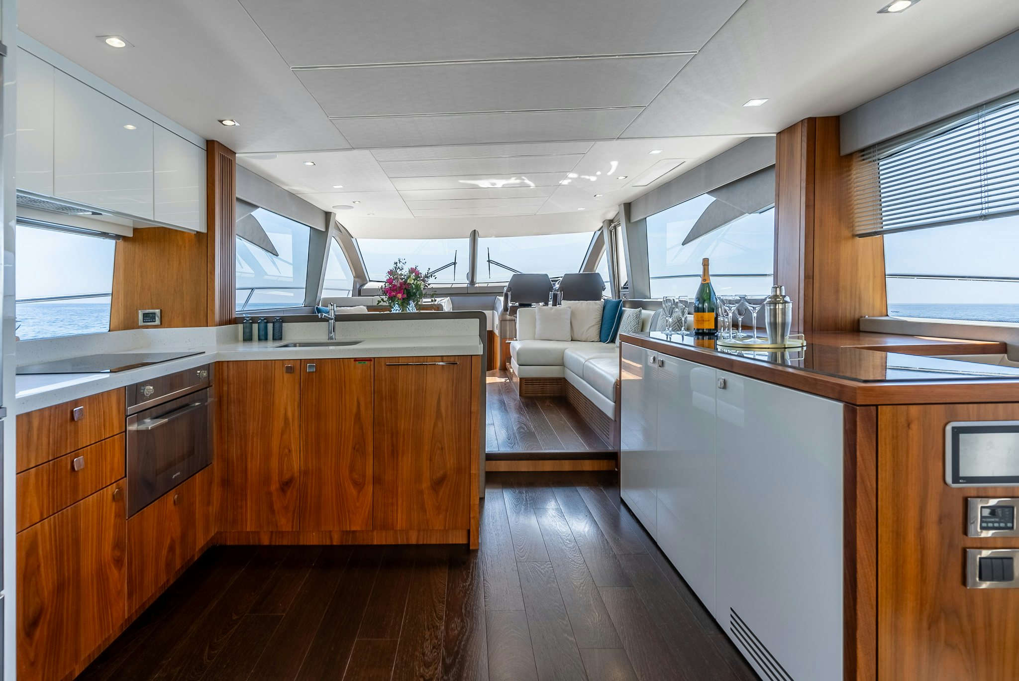 a kitchen with a wood floor aboard ISLA DE FLORA Yacht for Sale