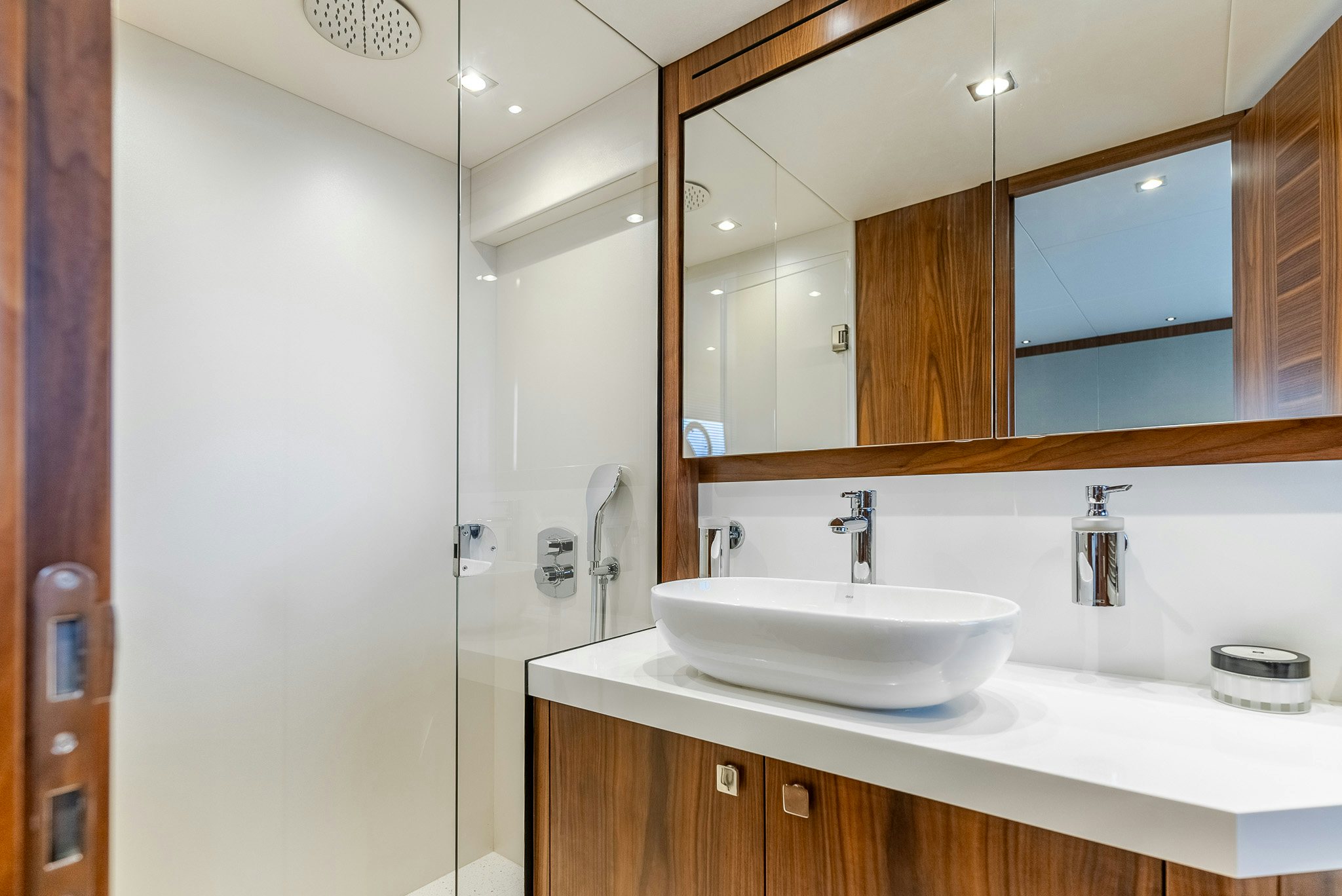 a bathroom with a large mirror aboard ISLA DE FLORA Yacht for Sale