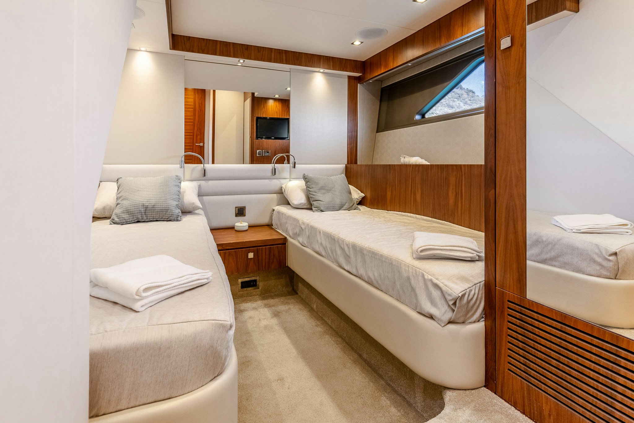 a room with a bed and a mirror aboard ISLA DE FLORA Yacht for Sale