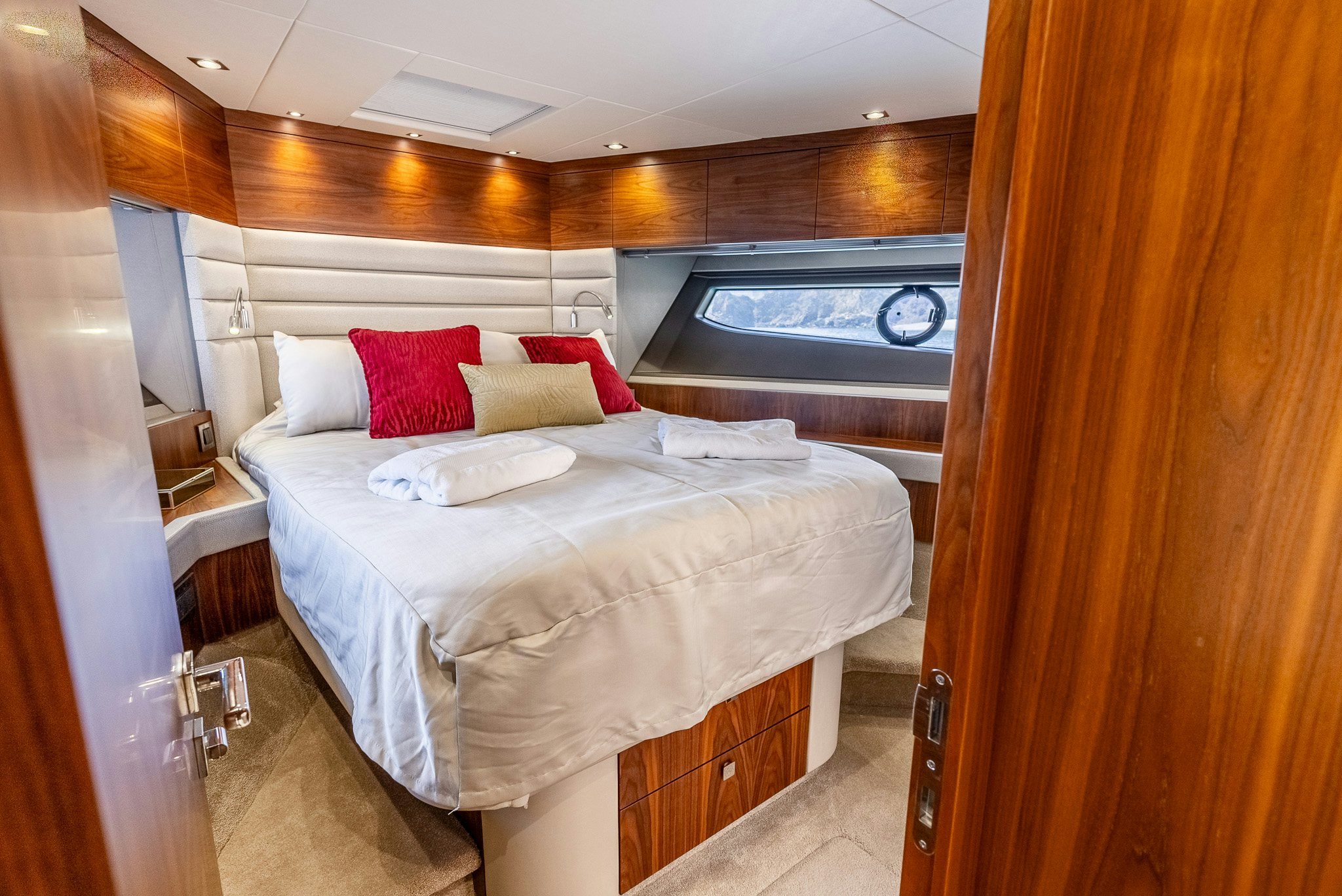 a room with a bed and a television aboard ISLA DE FLORA Yacht for Sale