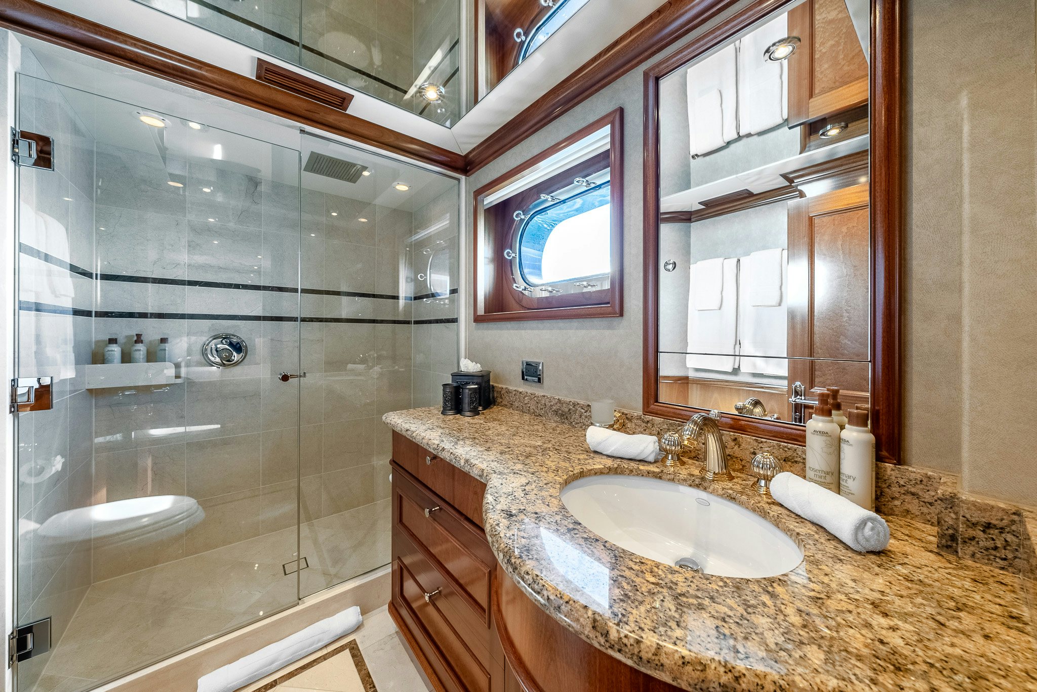 a bathroom with a glass shower aboard CALLIOPE Yacht for Sale