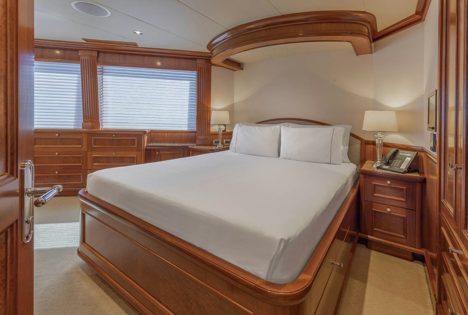 a bed with a white sheet aboard CALLIOPE Yacht for Sale