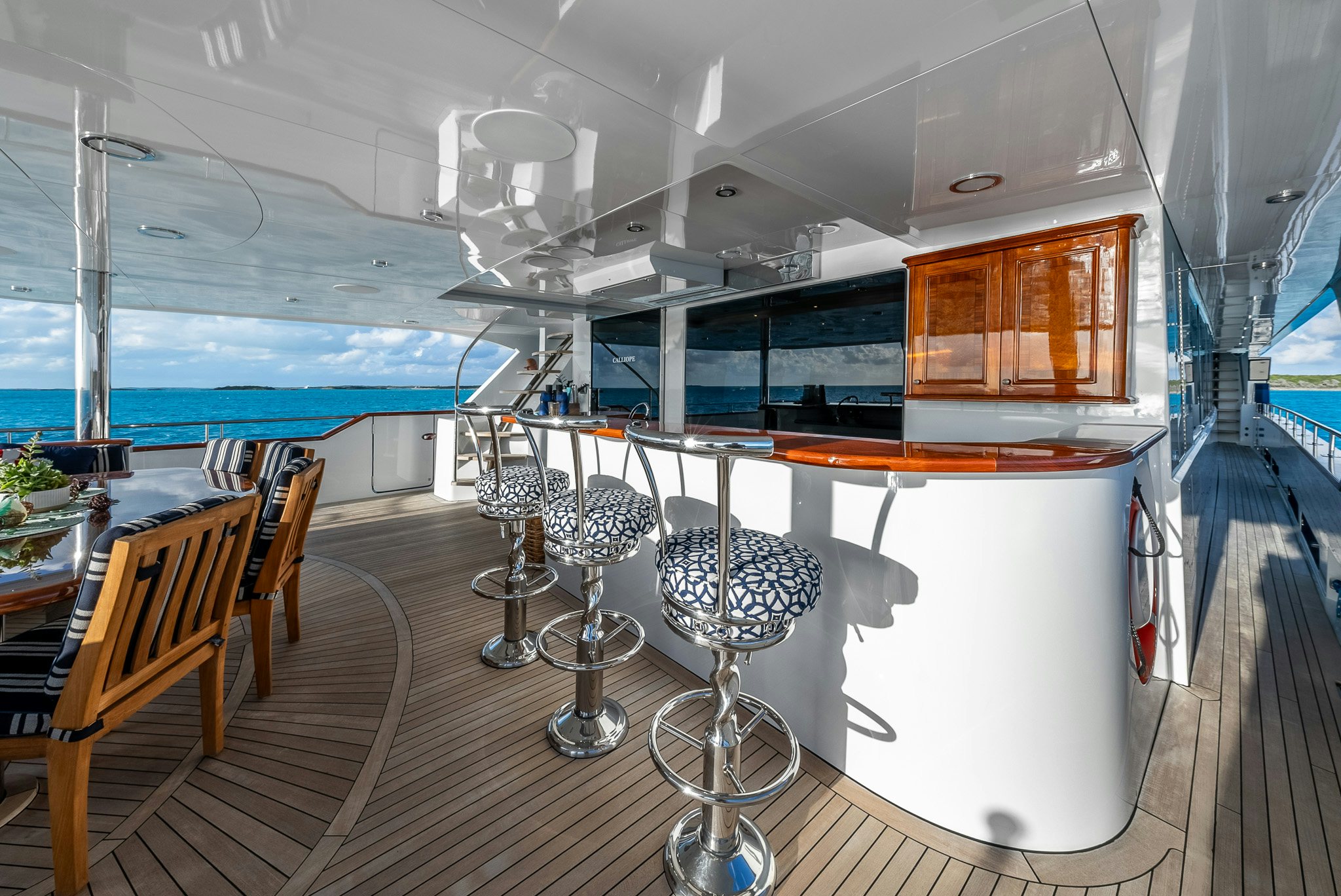 a room with tables and chairs aboard CALLIOPE Yacht for Sale