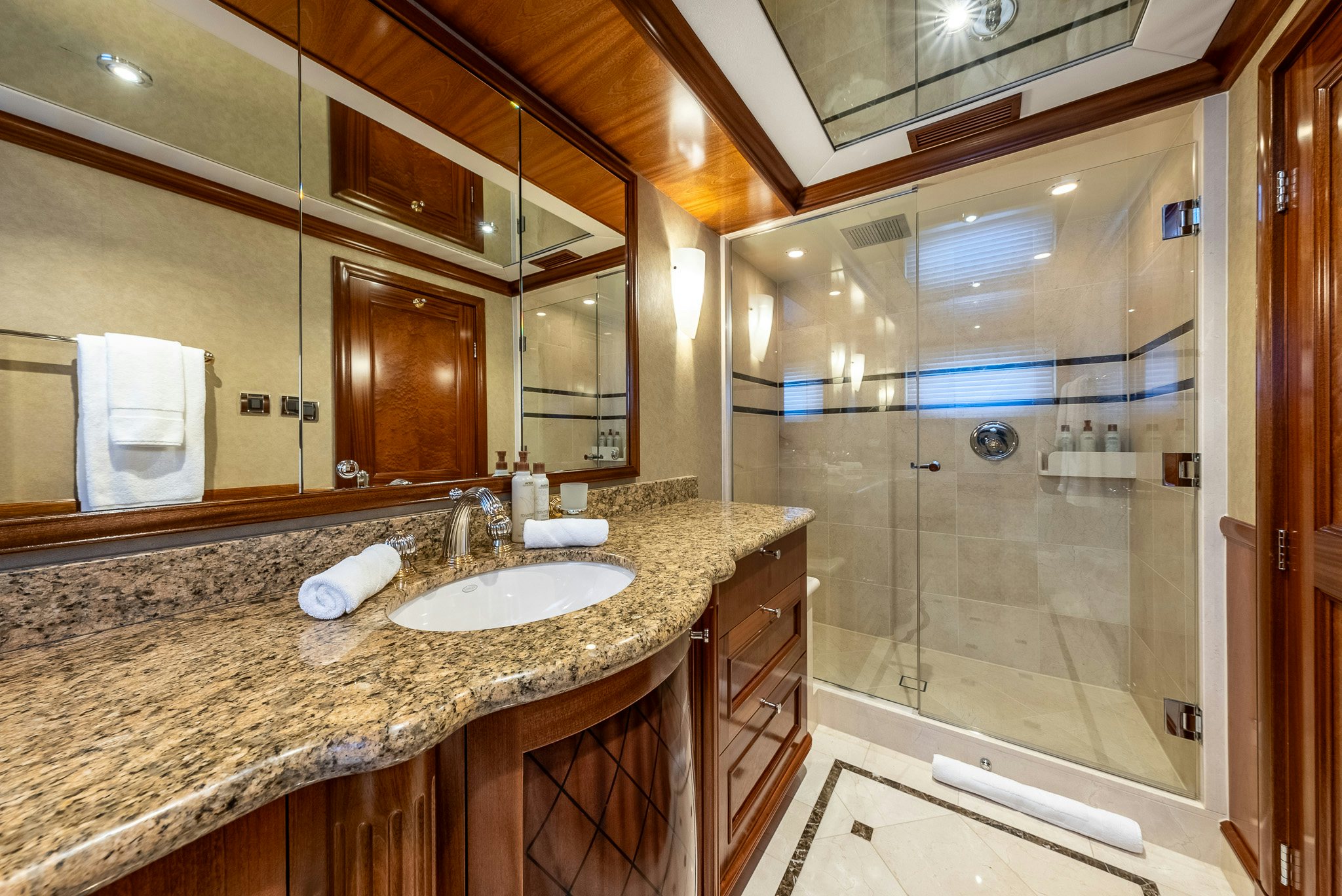 a bathroom with a marble countertop aboard CALLIOPE Yacht for Sale