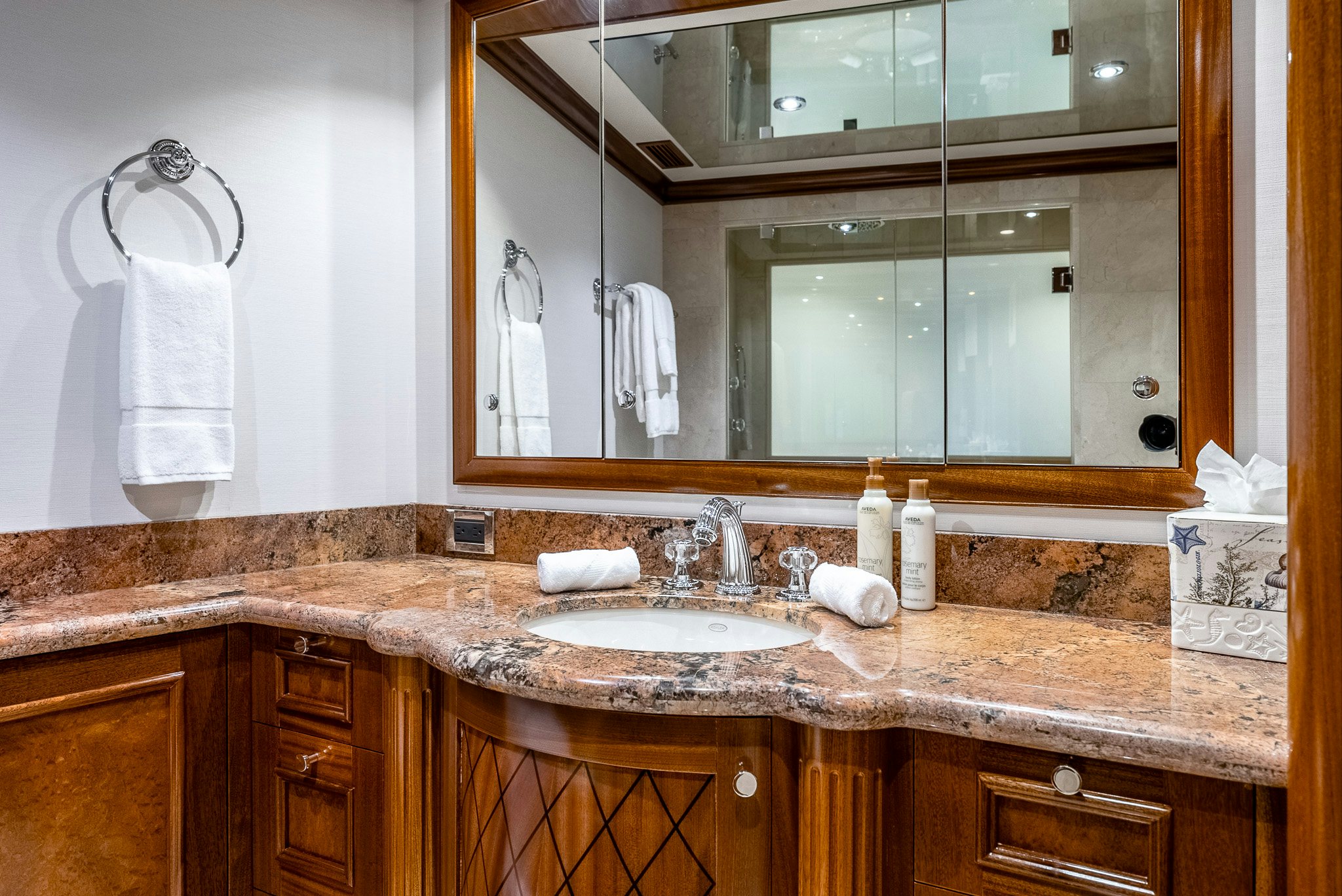 a bathroom with a large mirror aboard CALLIOPE Yacht for Sale