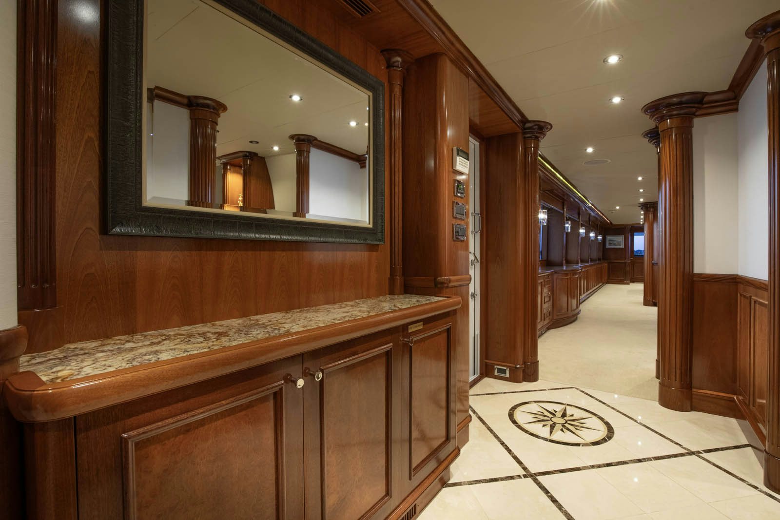 a large wooden cabinet in a room aboard CALLIOPE Yacht for Sale