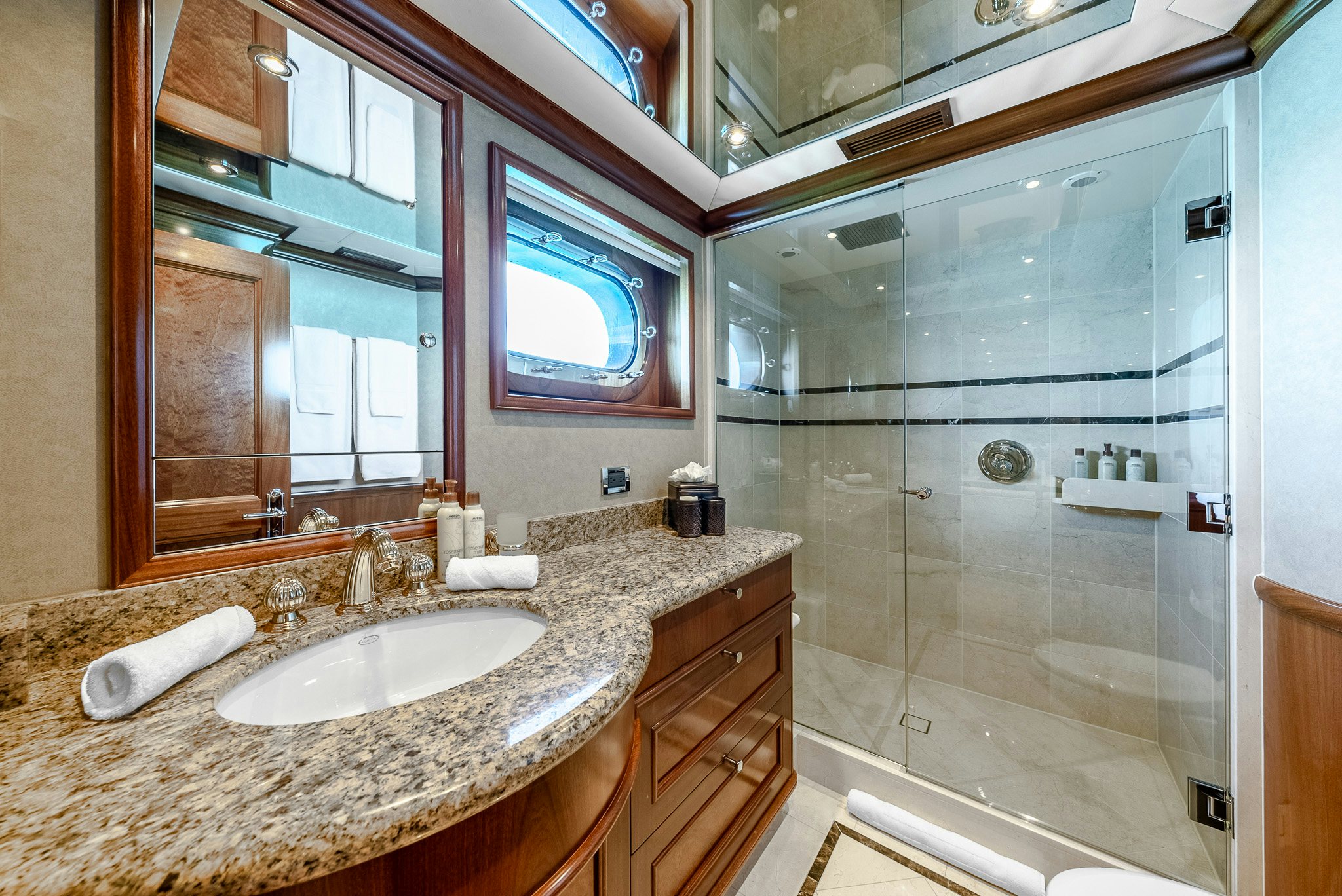 a bathroom with a glass shower aboard CALLIOPE Yacht for Sale