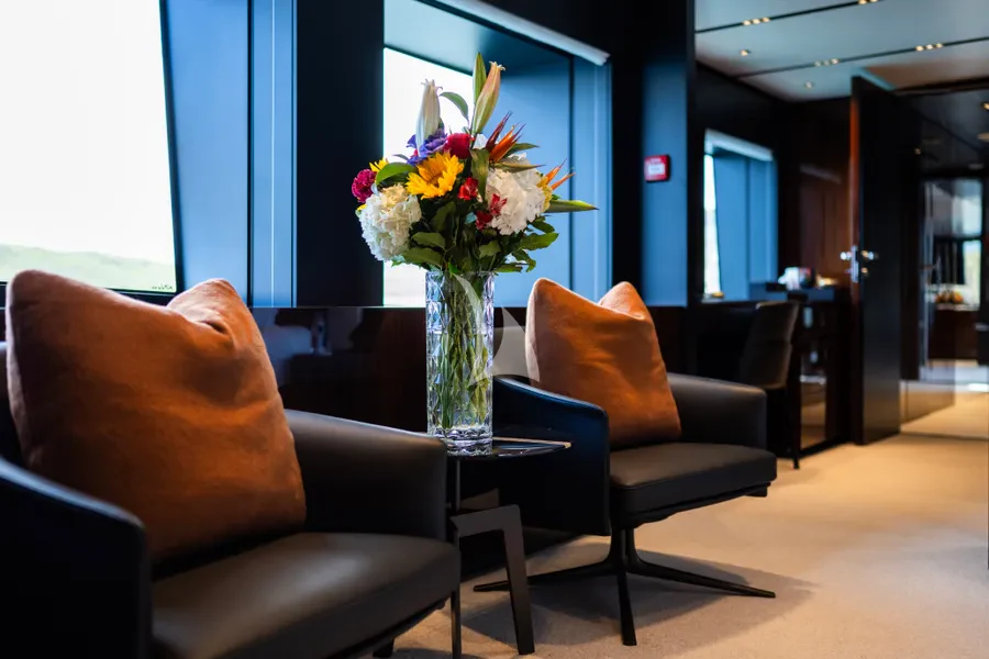 a vase of flowers on a table aboard TASTY WAVES Yacht for Charter