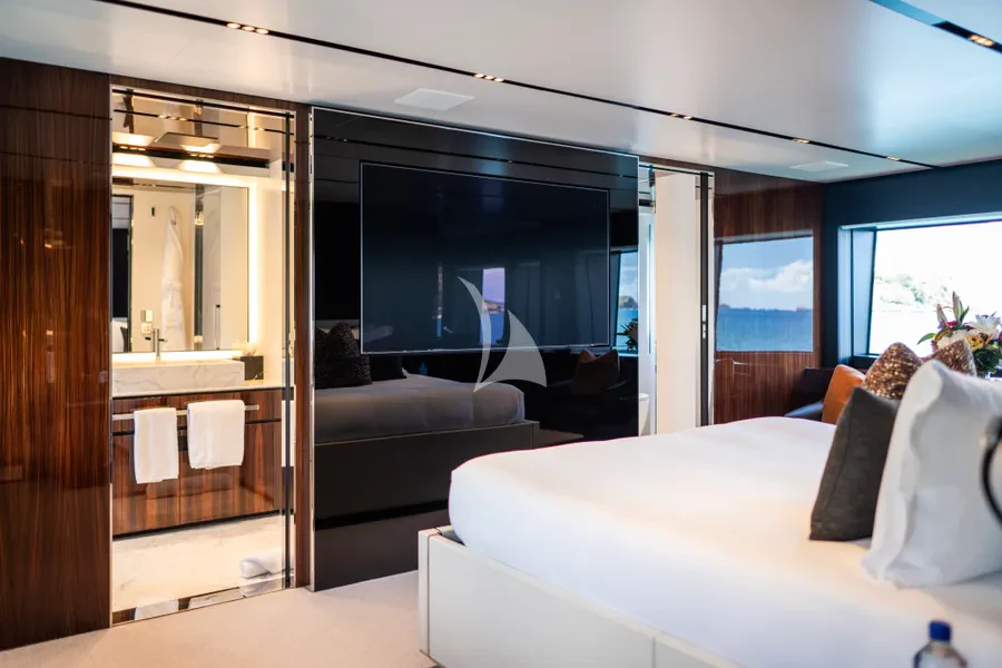 a room with a couch and a tv aboard TASTY WAVES Yacht for Charter