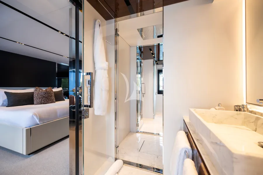 a bathroom with a bed and a bathtub aboard TASTY WAVES Yacht for Charter