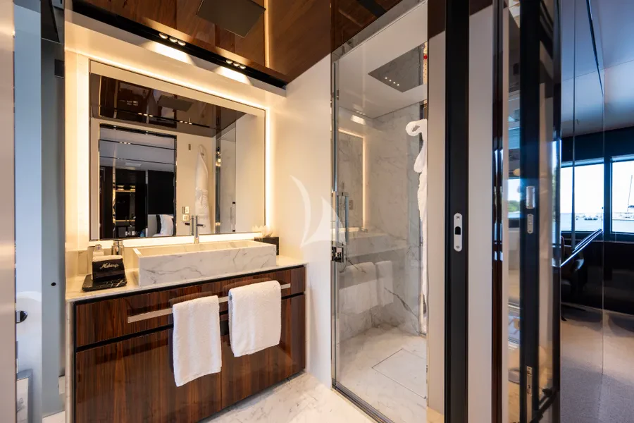 a bathroom with a countertop sink and mirrors aboard TASTY WAVES Yacht for Charter