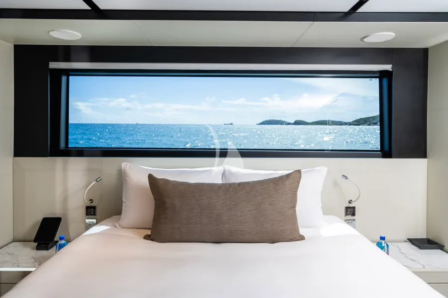 a bed with a large screen aboard TASTY WAVES Yacht for Charter